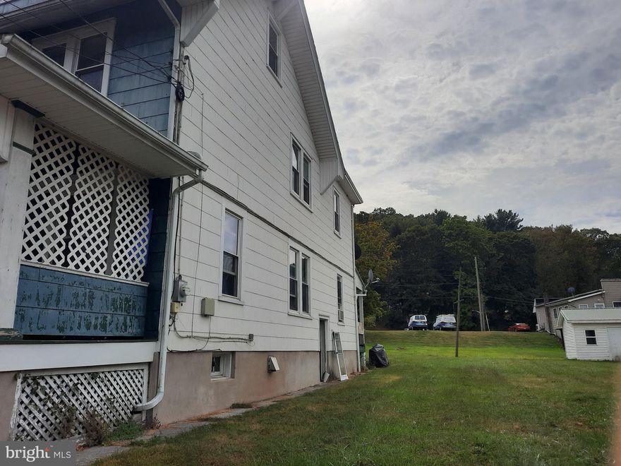 This three bedroom, two bath, semi-detached home offers lots of space.  The living room is hardwood floor, and there is a first floor bathroom complete with walk-in shower.  The property does need some updating but it is ready for a new owner to make it the perfect home.