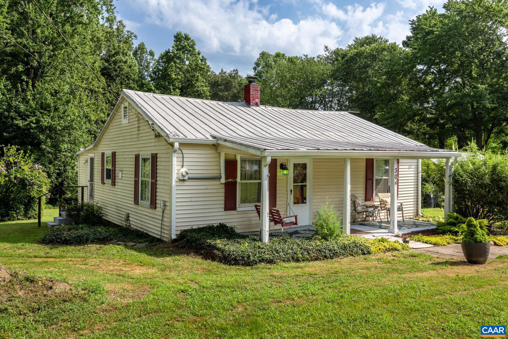 Adorable home only 15 minutes away from Pantops Mountain! Serene ONE LEVEL LIVING on almost 2 acres of land w/ a multitude of outbuildings. Upon entry is a cozy FORMAL LIVING RM that leads into the EAT-IN Kitchen. The FAMILY RM is gloriously spacious for TV, games, and recreation. The yard has many flowering trees/bushes with ample open space for outdoor activities while maintaining a mature forest along its perimeter for privacy and exploring. The large laundry room also serves as an area for storage. Minutes from the Albemarle County line and close to retail/grocery shopping, restaurants, Martha Jefferson Hospital, and the Historic Downtown Mall!,Wood Cabinets