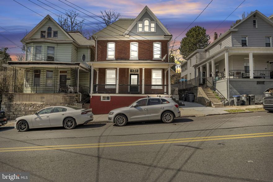 Welcome to this charming home in the heart of Steelton Borough, a quaint town known for its welcoming community and rich history. This well-maintained property offers a perfect blend of classic character and modern amenities, making it an ideal place to call home. Upon entering, you're greeted by a spacious, inviting entryway that sets the tone for the rest of the home. The beautiful hardwood floors flow throughout, adding warmth and timeless appeal to each room. The large baseboards and trim showcase the craftsmanship and attention to detail true to older homes, providing a sense of charm that can't be replicated. The open-concept living and dining areas are designed for both comfort and style, with soaring 10-foot ceilings that create an airy, expansive atmosphere. The kitchen features sleek stainless steel appliances, perfect for preparing meals and entertaining. Whether you're cooking for yourself or hosting a gathering, the layout ensures everything flows seamlessly. The first floor also offers a true retreat with the primary bedroom conveniently located on this level, providing easy access and privacy. Adjacent to the bedroom is a versatile office, den, or playroom with its own private entrance—ideal for a home office, studio, or a cozy space for the whole family. A full bath on the first floor ensures added convenience.
Upstairs, the second floor offers four generously sized bedrooms, perfect for family living or accommodating guests. The spacious hallway connects the bedrooms with a dedicated laundry area for added convenience. The large second-floor balcony extends the living space outdoors, offering a peaceful spot to relax with a morning coffee or unwind after a long day. On the third floor, you’ll find two additional rooms with abundant natural light, perfect for a home office, hobby area, or playroom. These rooms provide flexibility to fit your lifestyle needs and make the most of the home’s space.
The fairly private backyard is a tranquil retreat, ideal for outdoor gatherings, gardening, or simply enjoying a quiet moment. The back porch adds to the appeal, offering a lovely space for relaxation in the fresh air.
With a new water heater installed in 2024 and efficient gas heat, this home offers modern convenience while maintaining the charm and character of an older property. Conveniently located near highways, this home is ideal for commuters while offering the comfort and peacefulness of living in a smaller, close-knit community. This home is a true gem—thoughtfully designed, filled with character, and ready to welcome you.