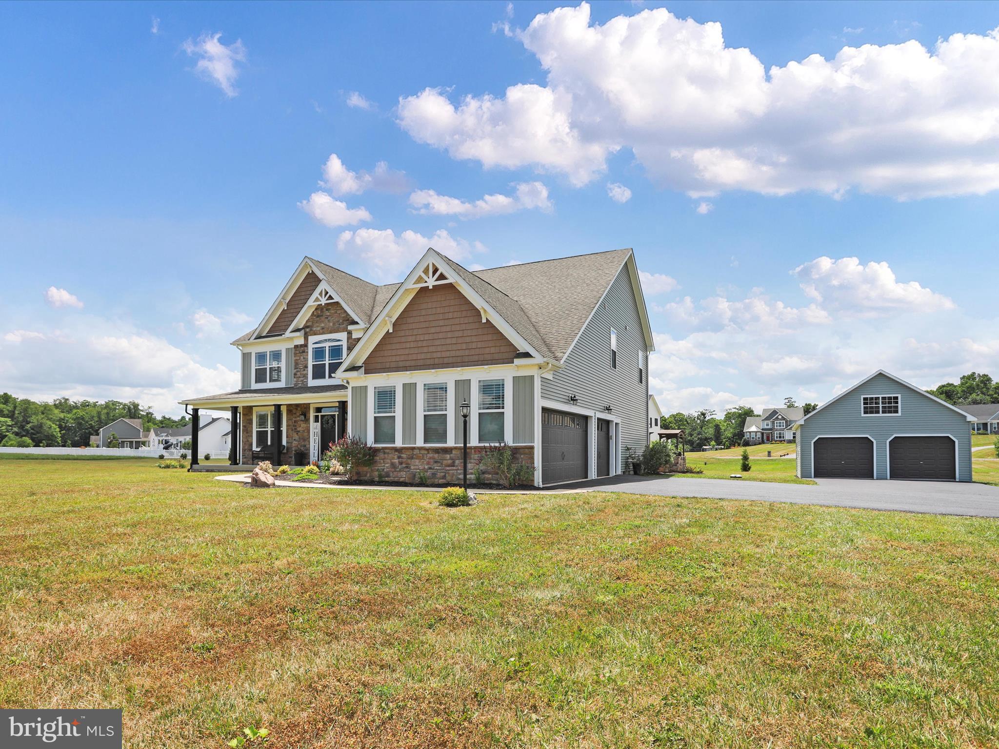 HUGE Price Adjustment!
This exquisite colonial sits on the Falling Waters - Hedgesville line making it a very convenient location! The home was custom-built in 2017, featuring all the upgrades that combine elegance with convenience, including: a Main level bedroom, full bathroom and an office with an exterior entrance, laundry on the upper level and more.
The beautiful layout lends well to family time or entertaining from gathering around the kitchen island, to bringing everyone together in the formal dining room or relaxing in the great room enjoying the gorgeously mantled gas fireplace.
Take your pick from dual hardwood staircases that lead you upstairs where you can retreat to a Primary Extra-large Suite that was truly designed for royalty with trey ceilings, fireplace, a lowered sitting area and mounted TV. This accompanied by a dreamy Primary Bathroom featuring a huge multi-feature shower, jetted soaking tub, dual sinks with dressing table and a large walk around closet attached.
Laundry room is on the upper level for even more convenience.
This home offers plenty of space with a total of 5 spacious bedrooms and 3 full bathrooms with even more room to expand or build your dream in-law suite, rec room, or Man/Lady Cave in the basement, which also has roughed in plumbing.
Outside you can appreciate the view of 1.38 acres of open space and entertain your guests on the stamped concrete patio while cooking in an idyllic outdoor stone kitchen! Attached is a Huge oversized garage for 3 cars as well as a new detached 2 car garage with a loft!
Open House Saturday June 29th 11 Am - 1 Pm Bring that checkbook!