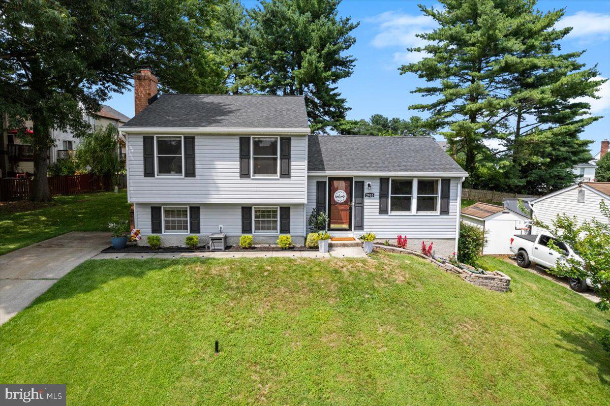 Welcome to this beautifully maintained split level home, with 2,040 sq ft, featuring 3 spacious bedrooms and 1.5 bathrooms- offering comfort, functionality, and style throughout. Step into a bright and open living room. adorned with crown molding and laminate flooring. The separate dining room, also with crown molding, offers walkout access to the large deck perfect for entertaining and enjoying the outdoors. The updated kitchen is a chef's delight showcasing brand -new cabinets, granite countertops, deep sink, stainless steel appliances, and stylish ceramic tile flooring. Upstairs., all three bedrooms are generously sized, freshly painted, and feature new carpet & memory foam padding. The primary bedroom includes a ceiling fan and a spacious walk-in closet for added comfort. The cozy, lower- level family room features a wood- burning fireplace with a handsome wood mantle-ideal for relaxing evenings. The lower level also offers a half bath, laundry area, and storage space. additional features include a sump pump, a radon mitigation system. This home is topped off with new architectural shingles and gutter guards for long-lasting protection and peace of mind. The home is located in a vibrant community with walking trails, picnic area, Volleyball courts, and an optional membership to the community pool. This home offers the best of suburban living.