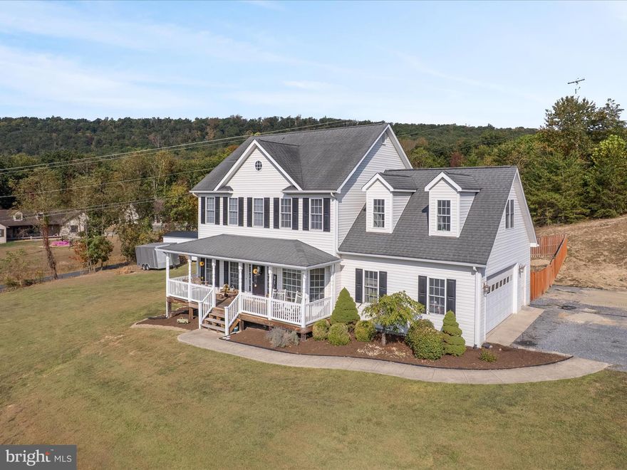 Welcome to this Beautiful Colonial-style Home in the sought-after Water View Estates community of Capon Bridge. Perfectly positioned on a spacious corner lot with nearly ¾ of an acre, this property offers stunning valley and mountain views along with access to the Cacapon River via a private deeded river lot.
Step inside to find an inviting Foyer, gorgeous hardwood floors, and 9-foot ceilings that create a bright, open feel. The Main Level features a spacious Living Room, a well-appointed Kitchen with ample cabinet and countertop space, a separate Dining Room, and a convenient Laundry/Mudroom that leads to the spacious 2-Car Garage.
Upstairs, you’ll find 3 comfortable Bedrooms, 2.5 Baths, and a large Bonus Room above the Garage—ideal for a Guest Suite, Home Office, Media Room, or Playroom. The Primary Suite offers a Primary Bath, walk-in closet, and a spa-like bath with double sinks, a walk-in shower, and a jetted soaking tub.
Downstairs you'll find a full unfinished Basement, which provides plenty of potential, already roughed in for a bathroom and additional rooms. Step outside, grab your coffee, sit back and relax on the peaceful covered Front Porch in the swing or rocking chairs. Around back you'll find a partially fenced in yard, a deck that's perfect for those Summer BBQ's, and a 12x24 shed. 
Located on paved roads in a welcoming neighborhood, this Home blends comfort, space, and outdoor living—all just minutes from town. With exclusive access to the Cacapon River, you’ll enjoy fishing, kayaking, and relaxation right in your community. Less than 30 minutes to Winchester, roughly an hour to Northern VA, Fiber Optic Internet is available, don’t miss your chance to make this Capon Bridge gem your forever home!