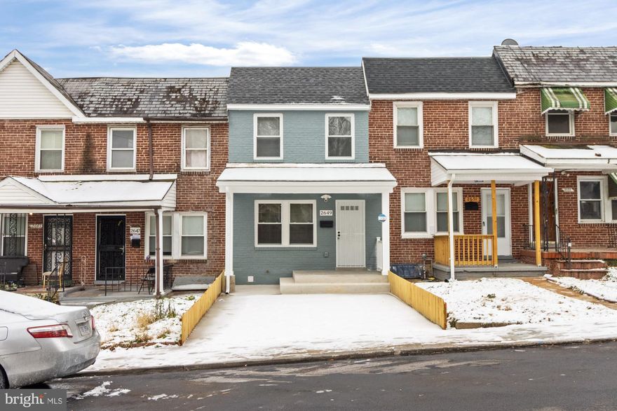 Welcome to this completely renovated 3-bedroom home in West Baltimore, thoughtfully updated from top to bottom. The home showcases a brand-new kitchen with quartz countertops, a center island, and upgraded stainless steel appliances, while the living room features an electric fireplace with a striking designer accent wall. The first floor offers hardwood flooring and a rear addition, adding extra living space. Upstairs includes two bedrooms, one of which features a walkout to a spacious deck, while the fully finished basement provides an additional bedroom and full bathroom. Major upgrades include the bathrooms, new electrical wiring and plumbing, new HVAC system, water heater, roof, and windows. The exterior is complete with a new rear fence and a convenient 2–3 car parking pad, making this move-in-ready home a standout opportunity.