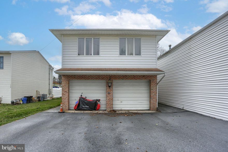 Standout unique property.  Features two upper floor apartments each with bedroom, kitchen, bath, and living room. Apartments have the same floor plan. Street level is a 23 X 23ft garage with 11ft ceiling, over sized garage doors, and powder room. Building perimeter is constructed with concrete block and spandeck ceiling construction. Second ground level space is a 23 X 27ft vault with a heavy duty safe door. This vault is also constructed with poured concrete block and 11ft.  spandeck ceiling with drywall finish. These ground level areas are substantially secure and offer numerous opportunities for specialty uses.