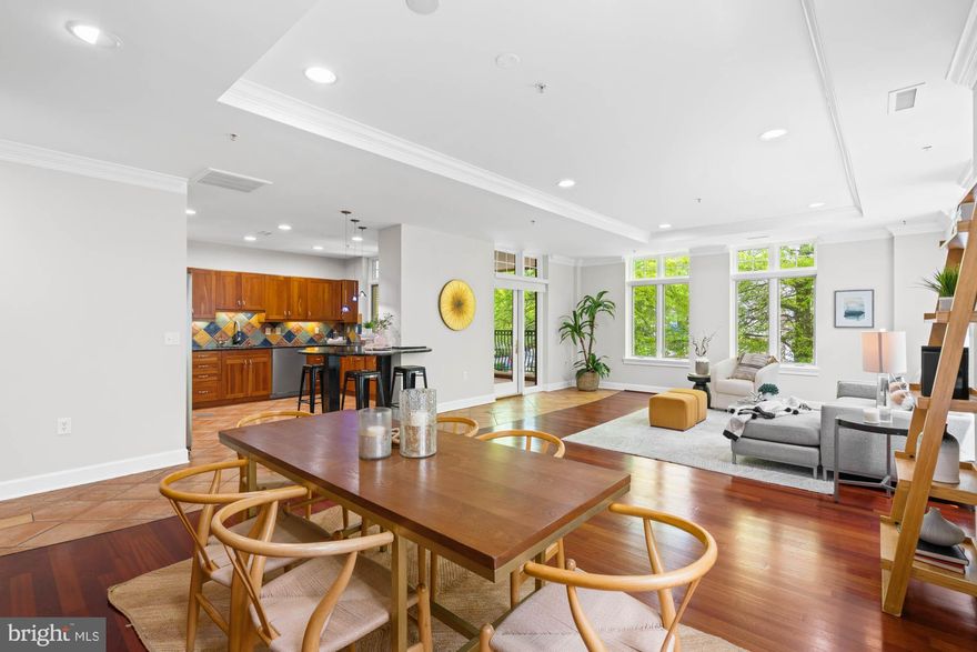 Rare offering in the heart of downtown Bethesda. Discover an exquisite living experience where sophistication meets convenience. This open 1,757 square foot 2 bedroom, 2.5 bathroom corner unit in the exclusive Edgemoor at Arlington Condominium offers an unparalleled lifestyle for those seeking quiet luxury without compromising convenience. 

Nestled in a 2003 boutique building with only 11 units, this elegant condo provides a tranquil retreat amidst the vibrant downtown scene. As you step into Unit 203, guests are welcomed into the formal foyer entry, setting the tone for the refined living spaces within. The floor plan seamlessly delineates between entertainment and private areas, with the open living and dining room adorned with crown molding, tray ceilings, and recessed lighting, providing a sophisticated setting for gatherings or relaxation. 

The spacious, eat-in gourmet kitchen boasts top-of-the-line appliances, including a six-burner Viking range, and a peninsula breakfast bar. Flooded with natural light from the windows lining the unit, the private covered balcony offers space for enjoyment of coffee or cocktails. Down the hall, two bedrooms await, including the primary bedroom suite featuring a large closet and an updated en suite bathroom with dual vanity, bidet, and oversized shower.  The additional bedroom is generously sized, suitable for guests or as office space. A hall full bathroom, full size laundry room with storage, and powder room completes the floorplan. 

With two designated parking spaces and an extra storage bin, coming and going is effortless. The Edgemoor at Arlington Condominium enjoys a prime location, with the Metro just two blocks away, along with nearby amenities such as the Morella Library, Giant and Safeway supermarkets, and a plethora of restaurants, shops, and entertainment options. 

Professionally managed, pet-friendly elevator building includes assigned garage parking, secure lobby access, parcel room, common roof access, along with professionally furnished lobby. Three guest parking spaces behind the building, along with street parking nearby.  This rare offering is perfect whether you prefer move-in ready convenience or the opportunity to personalize your space, this condo awaits, promising an unparalleled lifestyle in the heart of downtown Bethesda.  Square footage is estimated and should be independently verified by Buyer.  Information is deemed reliable, but not guaranteed.