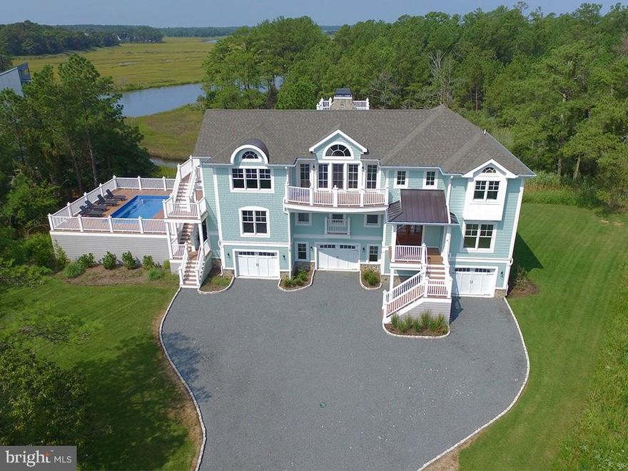 Gorgeous new construction recently completed in North Shores! Exceptional design featuring open floor plan, vaulted ceilings, & every imaginable amenity. True gourmet kitchen featuring Subzero/Wolf appliance package, oversized granite island, tile back splash & pantry. Exceptional outdoor living spaces including large pool deck, multiple porches, balconies & rooftop deck with fireplace. Other features include elevator, 3-car garage, hardwood floors, A/V system, alarm, & gas fireplace. All strategically situated on almost an acre adjacent to Cape Henlopen State Park taking advantage of spectacular sunsets & views of the park & Lewes / Rehoboth canal. This home is a must see!