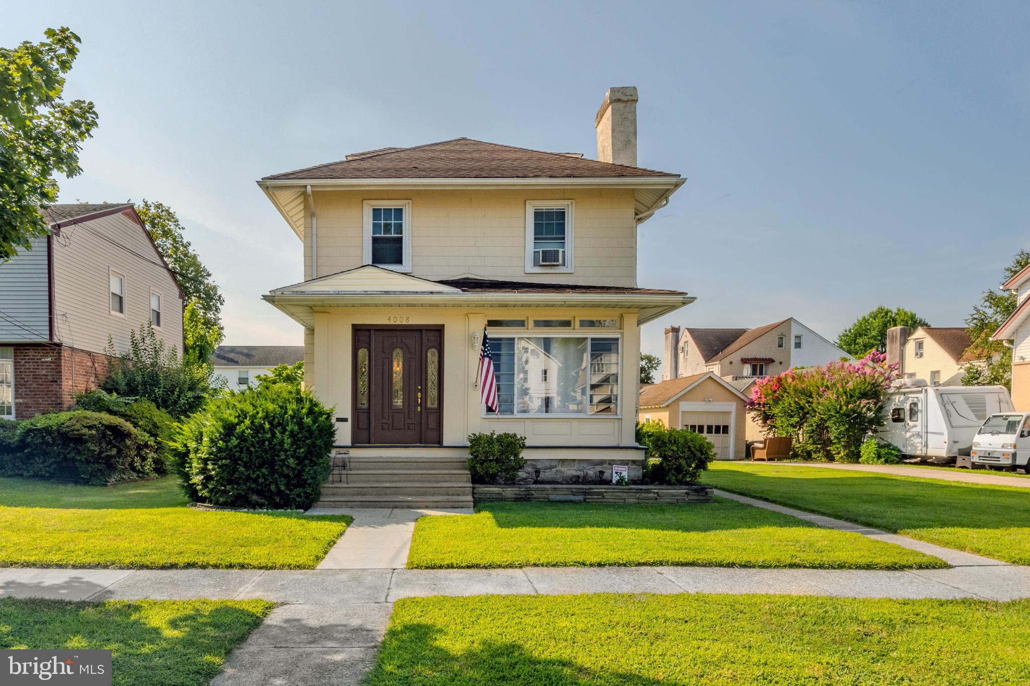 Welcome to 4008 Bonsall Avenue — where charm, space, and unbeatable outdoor living come together!
From the moment you pull up, you’ll be sold—just like the current sellers were when they first saw it. Now relocating for work, they’re passing this beloved home on to its next lucky owner. This traditional-style home sits on a truly unique 75x100 lot, offering one of the largest and most versatile yards in the neighborhood. Think: basketball court, pool, garden oasis—whatever your heart desires. Plus, the added bonus? Lower taxes than most nearby homes. Before stepping inside, take a moment to walk the grounds and imagine the possibilities that await you. Then enter through the sun-drenched enclosed front porch, the perfect spot to sip your morning coffee or greet guests with a smile. Inside, you'll find a spacious living room with inlaid hardwood floors and a stone fireplace featuring ventless gas logs (6/22). The formal dining room is filled with natural light and is perfect for gatherings. The updated eat-in kitchen features granite countertops, stainless steel appliances, oak cabinetry, and ample space for cooking and entertaining. Step right out the back door onto the flagstone patio for dining under the stars or enjoying your morning sunshine. Upstairs, you’ll find three generously sized bedrooms, each with great closet space. The hall bathroom was fully updated in 2020 and offers modern finishes and functionality. The lower level offers additional living space, providing flexibility for a home gym, office, media room, or playroom. You'll also find a workshop/utility room, laundry area, and a convenient half bath. And the outdoor space? It speaks for itself. Private, expansive, and ready for whatever you envision, with the bonus of a one-car garage and large driveway! Located within walking distance to Wawa, popular restaurants, bars, and public transit, including the trolley and bus routes—this location can’t be beat. Don’t miss your chance—4008 Bonsall is a slam dunk. Make your move today!