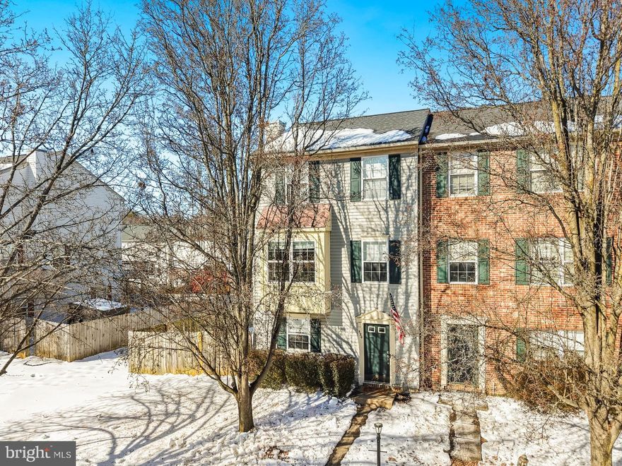 Beautiful 3‑level, end unit townhome offering a spacious and versatile layout. The fully finished walk‑out lower level includes a bedroom, full bath, and large recreation space, perfect for guests, extended family, or a private home office. The main level features a bright family room, an open kitchen, and a dedicated dining area—an ideal setup for everyday living and entertaining. Step outside to enjoy the brand‑new deck overlooking the fenced backyard, providing a great space for outdoor dining, play, or pets. The upper level boasts 3 bedrooms and 1 full bath, including a comfortable primary suite. With its flexible floor plan, fresh outdoor upgrades, and convenient location, this townhome is ready to welcome its next owner.