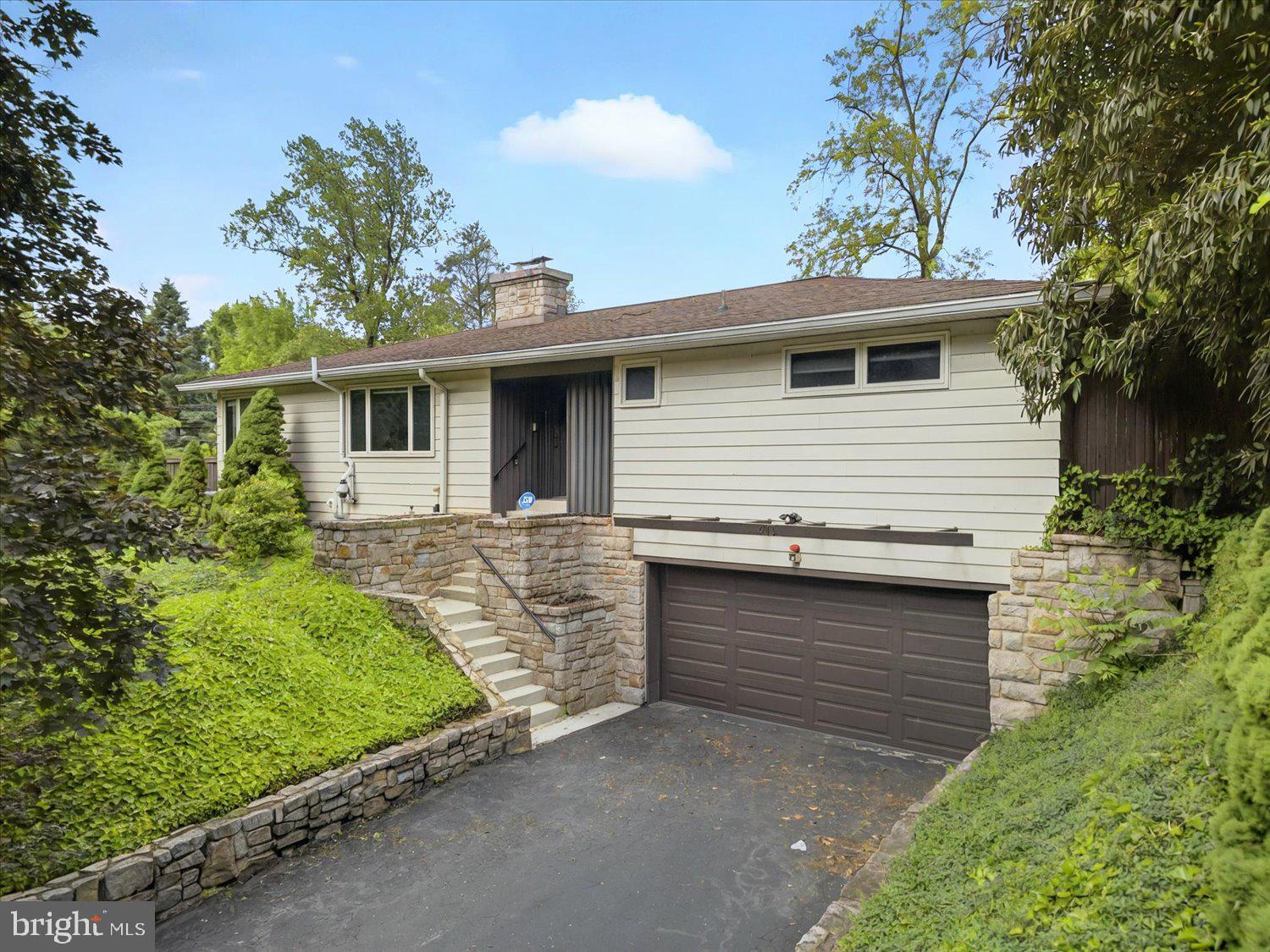 A wonderful corner property for the peace seeker located in Greenwood Hills community! Plenty of space, storage, and upgrades, and over 3,098 square feet of finished living space. A gas fireplace for you to enjoy in the cooler months. A kitchen offering all the space you could ever need. A heated sunroom with large windows to enjoy the views of your private yard. Recently renovated bathrooms, new flooring throughout, fresh paint, and fresh carpet - just installed - in the lower level, and new central air. The finished basement serves as additional living space and features a built in bar, and a ton of storage space. A fully fenced yard and extremely private surroundings make it a truly unique and serene property, while still located conveniently next to all of Harrisburg's amenities. Highly recommend you tour this home!