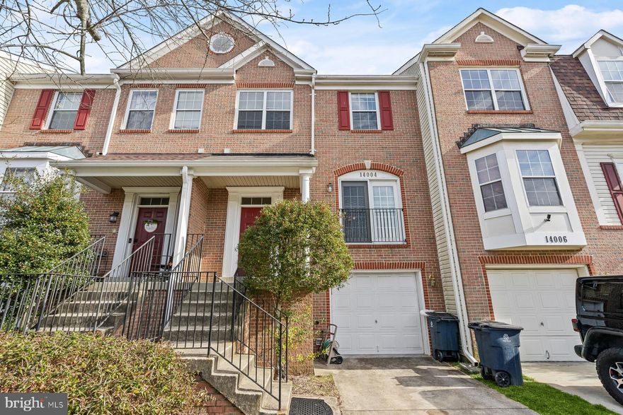 Welcome to this middle-unit townhouse in the Perrywood neighborhood.  The main level boasts an open living room connected to a large kitchen with dining space, ample storage with  deck access overlooking a beautiful green space and a half bath.  The upper level includes three bedrooms and two full baths. The primary bedroom suite has an attached bath with a separate shower and soaking tub, along with a walk-in closet. The fully finished walk-out basement leads to an open backyard with a recreation space and a half bath.  The property features a one-car driveway with garage and ample community parking. Community amenities include walk/jog/bike paths, two swimming pools, tennis courts, playgrounds, and a basketball court. Conveniently located near commuter routes, Watkins Regional Park, Six Flags, Oak Creek Golf Club, and shopping and entertainment options. Schedule your tour today.