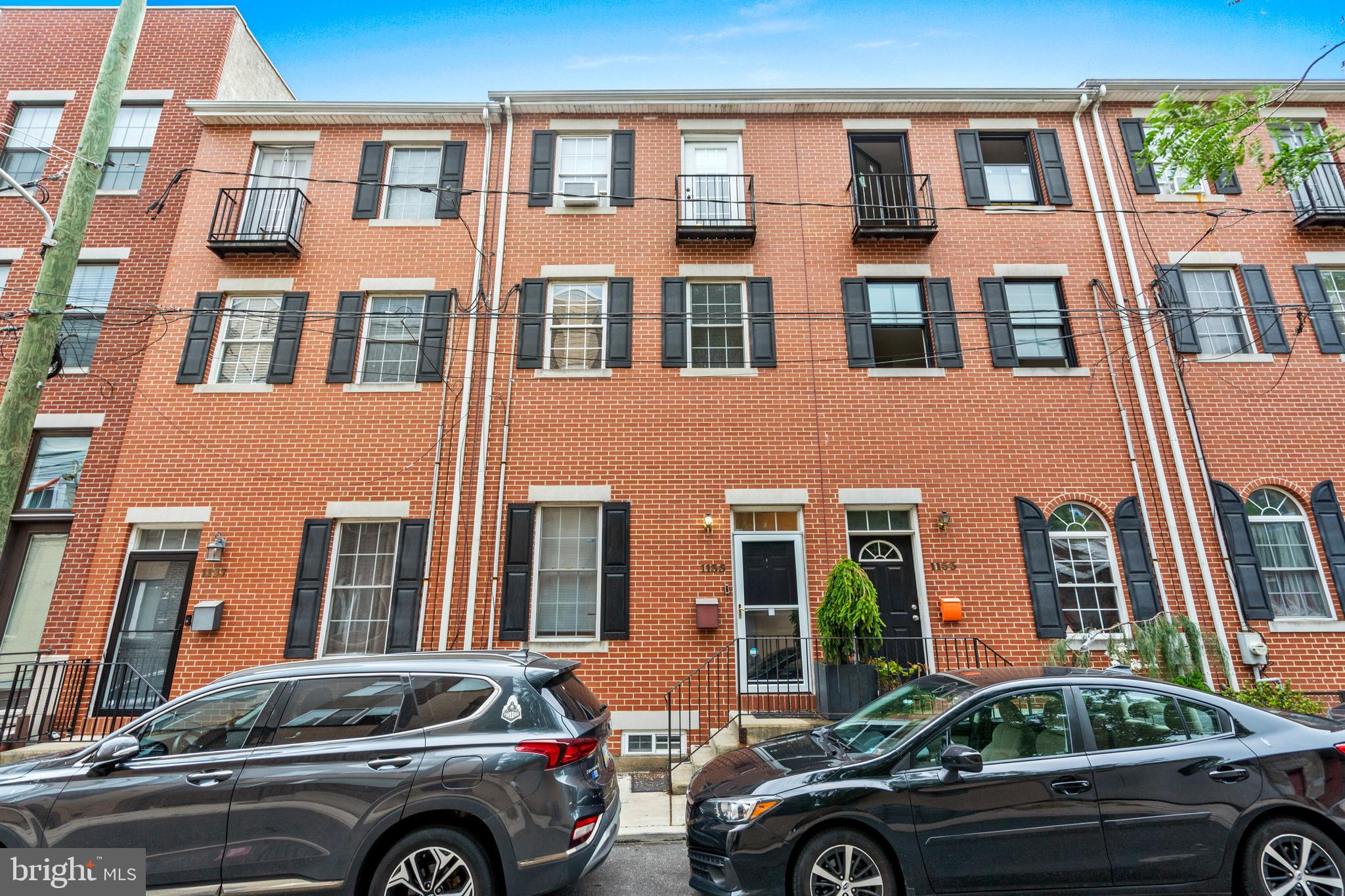 Step into this spacious Northern Liberties home featuring an open-concept living and dining area with beautiful oak hardwood floors, high ceilings, and recessed lighting. Just a few steps down, you’ll find a large eat-in kitchen complete with a center island and seating, tile floors, white cabinetry, granite countertops, and stainless steel appliances. The kitchen opens to a private garden and offers convenient OFF-STREET parking for one car or two smaller vehicles.
The fully finished basement adds approximately 350 square feet of additional living space, perfect for a family room or guest suite, and includes a full tiled bathroom, a separate storage room, and a washer/dryer.
Upstairs, the second floor offers two generously sized bedrooms and a neutral hall bathroom. The third floor features a bright sunroom with tile flooring—perfect for an office, gym, or extra closet space—leading to a spacious roof deck via sliding glass doors. A second washer/dryer hookup is also available on this level.
At the front of the third floor is the primary bedroom suite, complete with vaulted ceilings, a Juliet balcony, a neutral three-piece tiled bathroom, brand-new carpeting, and fresh paint. A transom window fills the upper floor with natural light.
Don’t miss this thoughtfully designed and spacious home in one of Philadelphia’s most vibrant neighborhoods!