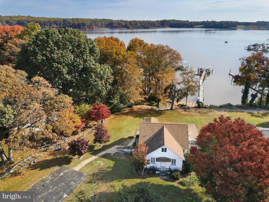 Perfect opportunity to add your personal flair to this Hansel & Gretel cottage located on the Bohemia River.  With a sandy beach, a shared interest in a dock and gorgeous views of Chateau  Bu-De across the river, magical opportunities await.  Come explore the possibilities today and start your journey to Eastern Shore living at its best.  Good bones and lots of recent updates.  Air conditioning unit replaced in 8/23.  Septic inspected in 9/23.  Well replaced about 10 years ago.  Roof replaced in 2010.  Water conditioner replaced 2-3 years ago.