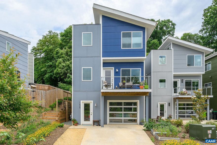 Sleek design elements abound in this like-new modern home located on a quiet cul-de-sac overlooking city owned green space. Such a fabulous location that you can: hop onto the noteworthy, wooded Rivanna Trail and meander by Moore's Creek or walk to social life Downtown, Belmont, Ix Park or 5th Street Station. This modern design includes expansive energy efficient windows to allow for tons of natural light w/extra windows & skylight, vaulted ceilings in three spacious bedrooms, gorgeous oak hardwoods throughout main/top level. Sought-after open floor plan with Dining Room, Kitchen & Living Room combination creates wonderful space for both hosting and comfortable everyday living. Additional custom design features include: custom kitchen (bright white cabinetry, granite counters, custom tilework & stainless appliances), baths (custom tile selections with frameless glass shower & double vanity in the Primary Bath), custom bar/entertainment built-ins & extensive custom closet built-ins. Enjoy the quiet of the parkland on the deck off of the Dining Room and a private oasis-like patio with gardens off of the Living room.  All within walking distance of city-life!,White Cabinets