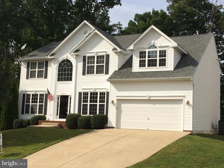 PRICE REDUCTION!!Remarkably large layout of a home made by Somerset Homes. Larger than county recorded. Move-in ready with fresh paint and clean as a whistle! Elegant dining with wine rack, office on main level, 2 story Great Room with gas fireplace, overly large bedrooms on 2nd floor and master has bonus sitting area & 2 walk-in closets. Full unfinished walk-out basement for your own recreation.