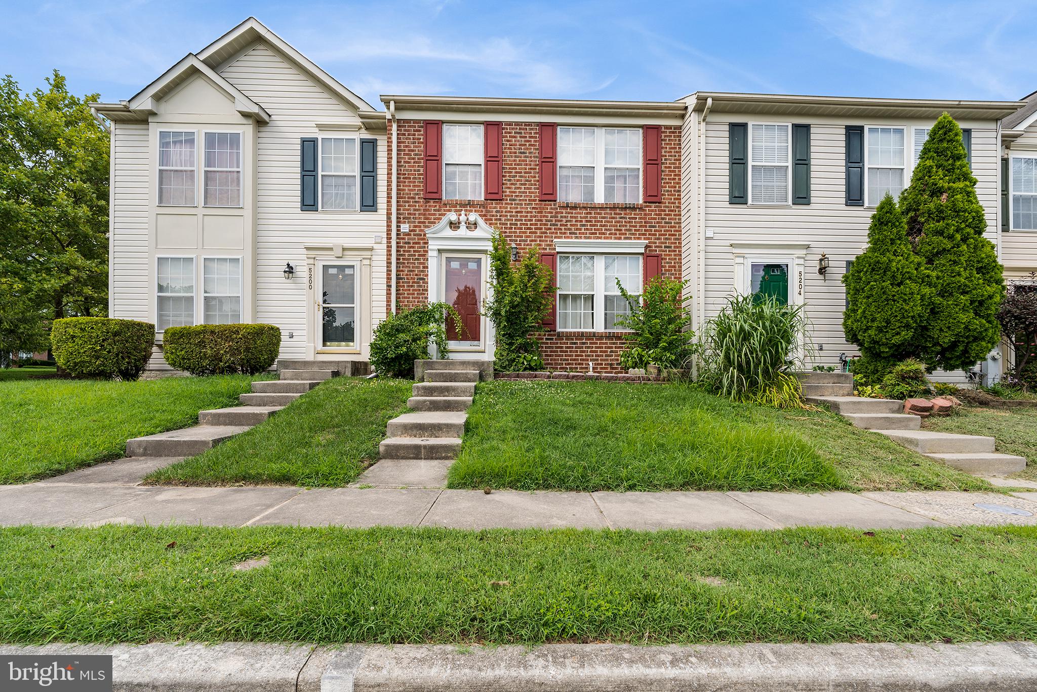 Here is your opportunity to own a great brick-front townhome in a wonderful community. Upon entering you'll find a light-filled living room featuring a stylish paint color and bright trim work. A convenient powder room is nearby. Bright laminate flooring leads into the large eat in kitchen with stainless steel appliances. A slider opens to the rear deck which is great for cooking out on warm afternoons or hanging out on cool evenings. Upstairs are two extra large bedrooms and a full bathroom with a dual sink vanity. The finished lower level is perfect for a home theater, gaming area, office, playroom, workout area or whatever you can envision. Near shopping, dining and attractions, this home is in a location you'll love. Check out the photos and 3-D tour and make your appointment to see it soon!