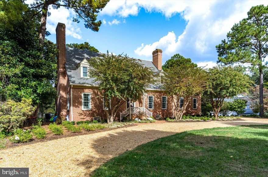 Priced below appraised value!  Welcome to this elegant and spacious home nestled in the prestigious Tony Tank neighborhood, offering luxurious living and serene waterfront views.  This magnificent three level residence, meticulously crafted by renowned builder Don Patterson, boasts timeless charm and modern amenities.  Upon entering, you are greeted by a grand foyer with two lighted closets and a staircase leading to the upper level.  The main level features 9 foot ceilings, hardwood flooring, and a sense of openness and airiness throughout the living spaces.  Four wood burning fireplaces are strategical located in the primary bedroom, living, dining, and family room, creating  a warm and inviting ambiance.  The family room fireplace has a new wood burning insert. The heart of the house lies in the newly renovated gourmet kitchen, equipped with top-of-line stainless steel appliances, beautiful new quartz countertops, and a convenient sitting area.  The kitchen seamlessly flows in the dining room and family room areas , making it ideal for entertaining and enjoying family.  There is a second staircase off the kitchen as well.  Additionally, the main level includes a library/office adorned with built-in bookcases, offering a quiet retreat for work or study.  A practical mudroom, complete with new flooring and cabinetry, provides easy access from the oversized two-car garage, ensuring a clutter-free entrance.  Ascending the staircase, you will discover the upper level featuring four bedrooms and three full bathrooms.  Two primary bedrooms, each situated at opposite ends of the house, offers luxurious en-suite bathrooms.  One of the primary bedrooms has a wood burning fireplace, a huge walk-in closet, walk-up attic access, and a newly renovated bathroom with heated floors.  Convenience is key with  a laundry room located on the upper level, eliminating the need to carry laundry up and down stairs.  The partially finished basement is a versatile area, featuring a kitchenette, 8 foot ceilings, storage areas, built-in shelves providing practical storage solutions, and a half bathroom for added convenience.    Stepping outside, you will find a brick patio overlooking the meticulously landscaped yard and the tranquil lake.  The property includes a private new dock creating the perfect spot for relaxing.  Additional features include new paint colors throughout, all new light fixtures, new windows and oversized sliders, functional seating in dormer windows, professional landscaping, exterior up lighting, new irrigation system, and new front sidewalk pavers. With its prime location near Salisbury University and Tidal Health, this property offers both convenience and exclusivity.  Impeccably maintained, freshly painted, and featuring hardwood flooring throughout. This residence is ready to welcome you home! Please call today for your private showing.