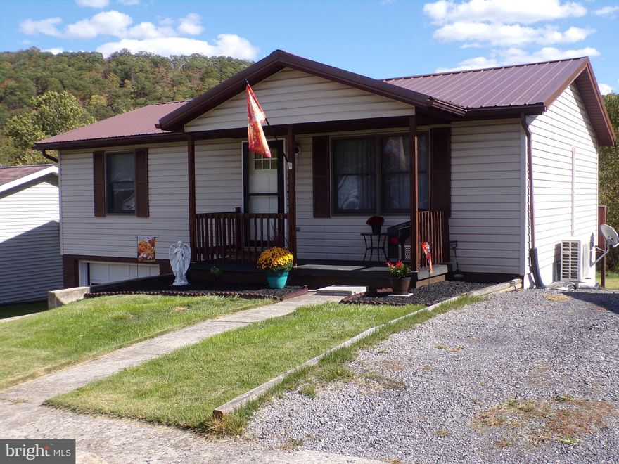 With newly installed hard wood floors and fresh coat of paint throughout, this adorable home should be at the top of your list of homes to see!  The efficient kitchen boasts stainless steel appliances that are only a few  years old and a breakfast bar plus there is a spacious pantry just off the kitchen.   The closet space throughout the home is remarkable with a walk in in the master bedroom and  in the bonus room on the lower level.  The lower level also offers bonus living space with two finished rooms and a full bathroom. Then, just in case you are looking for a place to relax, you may enjoy the covered front porch or the dual level deck overlooking mostly level back yard and majestic mountain views from every angle.  One of the best features about this home ...and it's a feature that you can't get just anywhere...the location.  This home has an excellent location, outside of town (so you can enjoy the wildlife that walks around the development) but so close it takes only minutes to get to shopping, restaurants, and more.