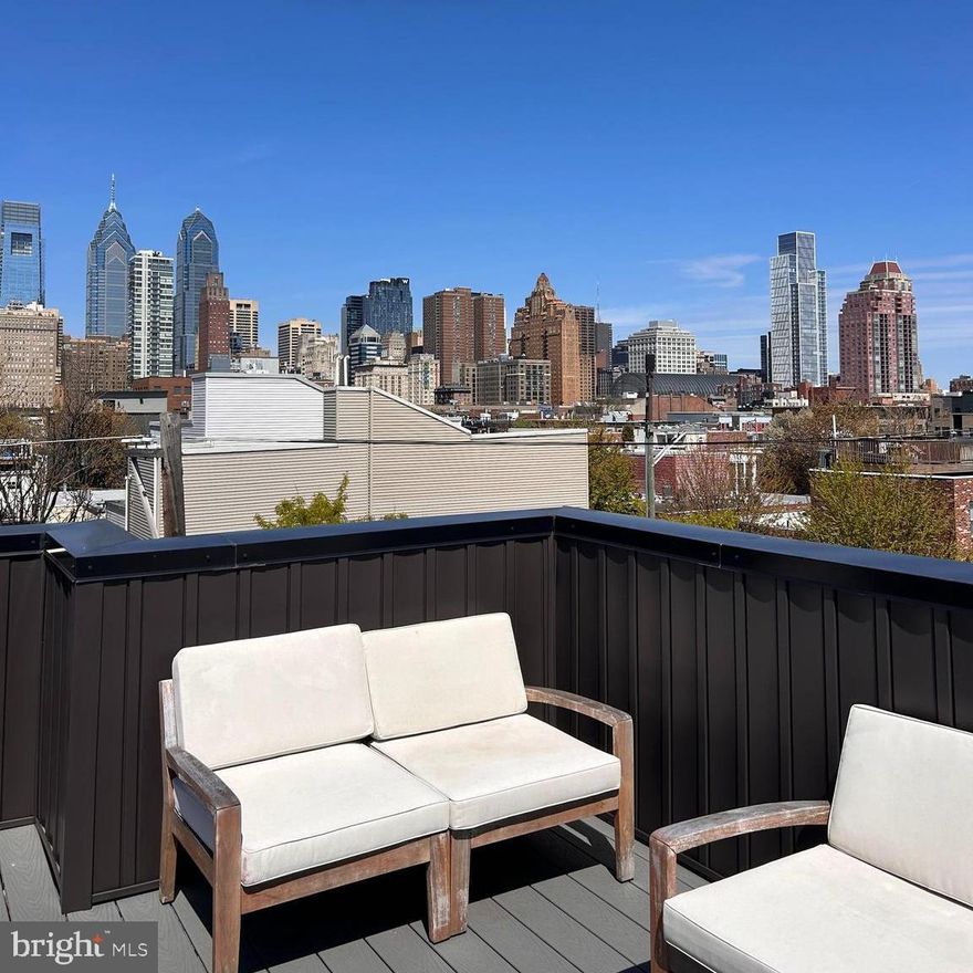 Stunning Roof Deck! Step inside this thoughtfully crafted home at 743 S Cleveland and find your entertainer's paradise in the heart of Graduate Hospital. Painstakingly restored in 2022, this residence features a third-floor addition and an unbelievable roof deck with city skyline views. The home speaks volumes through its exquisite details, including white-washed brick walls, a hand-crafted oak railing, and natural wood wide-plank flooring. The large chef's kitchen is a market standout with its sleek design, stainless appliances, ample storage, and a large island. This open-concept space flows effortlessly into the dining and living areas with soaring ceilings. The second floor offers two sunny, spacious bedrooms, a large tile hall bathroom, and dedicated laundry. Retreat to the primary level, which boasts a spacious suite with marble bath, complete with a skylit shower, dual vanities, and a soaking tub. A fully finished lower level with full bath finishes this fabulous townhome. This home is not to be missed! 10 year abatement available.