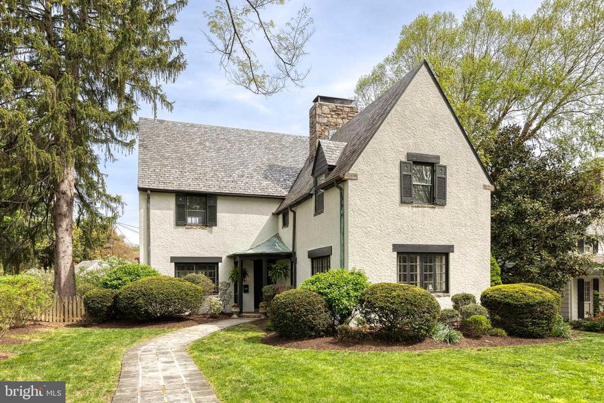 Discover an enchanting storybook Tudor home nestled on a quiet block in the heart of Homeland. This 4-bedroom, 2.5-bath residence exudes timeless charm, featuring a steep gable roof, covered entryway, and meticulously maintained historic exterior details. Inside, the home offers an inviting atmosphere blending cozy comfort with refined elegance, showcasing hardwood floors, rich millwork, and abundant natural light. The thoughtfully planned interior includes spacious, sunlit rooms perfect for both daily living and entertaining. Step outside to a private, landscaped, and flat, spacious yard—a rare find designed for relaxation and outdoor fun. A detached garage adds convenience and character to this idyllic setting. Experience the perfect harmony of historic ambiance and comfort in one of Baltimore's most coveted neighborhoods.