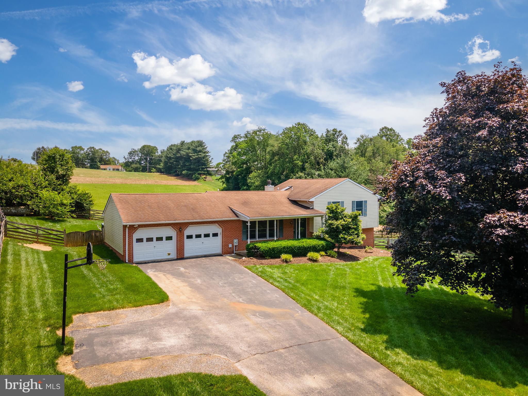 This is the weekend to take advantage of our recent price reduction. We have priced this home to SELL!!!
If you're looking for a new home in a beautiful, quiet neighborhood in Carroll County, look no further—this is the one for you! Nestled on a peaceful 1.11-acre lot in Westminster, this brick-front Split Level offers a perfect blend of charm, comfort, and potential. Built in 1989, the home features over 2,000 square feet of finished living space with an open and inviting layout that flows seamlessly from the kitchen to the living and dining areas. Upstairs, you'll find three generously sized bedrooms and two full bathrooms, offering plenty of space for family or guests. One of the standout features of this home is the thoughtfully designed owner's suite. The current sellers added a stunning primary bathroom addition, transforming the space into a true retreat. It now includes a large walk-in closet and a beautifully finished, spa-like bathroom, a double vanity, and plenty of natural light.
Out back, the home backs up to a picturesque farm, providing a scenic and peaceful backdrop for all your outdoor gatherings. Whether you're hosting summer pool parties, relaxing nights in the hot tub, or weekend BBQs on the patio, you'll love the privacy and open views. The oversized two-car garage offers ample space for parking, a workshop, and storage, making it ideal for hobbyists or anyone in need of extra room. The unfinished basement is a blank canvas, ready to become whatever you envision—whether it’s a media room, home gym, office, or playroom.
Additional features of this home include a hybrid water heater, humidifier, and a water softener & neutralizer for added comfort and efficiency. The living and dining rooms feature hardwood floors under the carpets, adding potential for even more beautiful updates.
Located in the sought-after 21157 ZIP code, this home is part of the Carroll County Public School system and offers convenient access to local amenities while still maintaining the peace and privacy of country living.