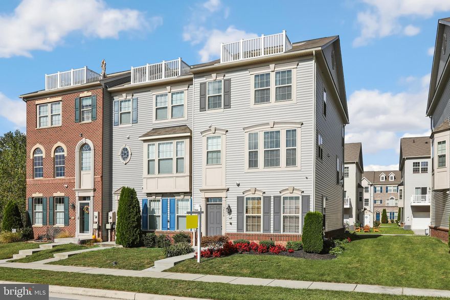 Like-new 4 bedroom, 3.5 bath, 2 car garage townhome in the water oriented community of Lakes at Stansbury Shore.  Stunning water views from your window and rooftop deck with room for outdoor living and entertaining space.  Home offers 4 finished levels with an open concept main floorplan, and entry level bedroom with private bath.  Living/kitchen/dining combination with stone gas fireplace, hardwood floors, recessed lighting, and slider door to the rear deck. Gourmet kitchen with granite countertops, island with breakfast bar, pendant lighting, stainless steel appliances, and dining space. Third level with 3 bedrooms including the primary bedroom suite, a full hall bathroom, and convenient laundry. Primary bedroom suite with walk-in closet and private bath with double vanity and walk-in shower. Fourth level with access to the rooftop deck, great for additional living space, office, etc.