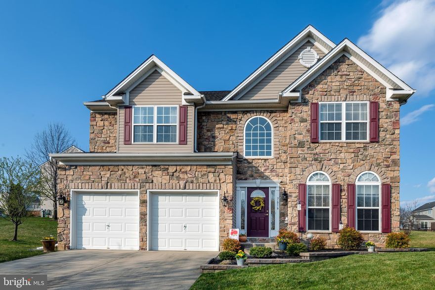 This stunning stone front, warm inviting home will not disappoint you! The formal living room is currently used as front office space and opens to the formal dining. The first floor family room with 2 story gas stone fireplace opens to the large eat in kitchen. The center island offers extra seating and cabinet space. Cabinets have rolling cabinet trays and roll-out trash bins. Combo microwave/convection oven makes entertaining easy. Sliders open to deck that faces open space.  Master bedroom suite with walk in closet has built in ironing board & Master bathroom which offers soaking tub and separate  shower. Spacious upstairs hall has overlook to family room.  There are 3 bedrooms with center hall bath. Full unfinished basement has plenty of space for you to add more living space. Professionally landscaped. Roof replaced in 2018 and HVAC system was updated in 2017. Come experience this beautiful home.
