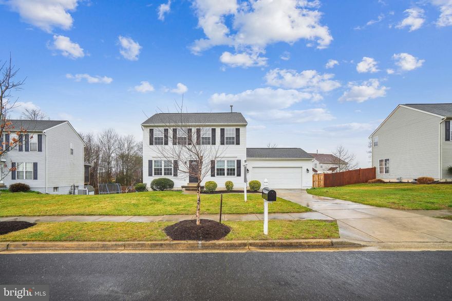 Welcome Home! Spacious 5 Bedroom 2.5 Bath Colonial with 2 Car Garage Awaits Your Personal Touch To Call It HOME! Fresh Paint, New Carpet, & Updated Hard Surface Flooring, All You Need To Do Is Decorate & Move In! Main Level With Beautiful Stone Wall Backed Built In Bookcase/Entertainment Center In Family Room Flowing Into Open Breakfast Area & Modern Kitchen, Large Formal Living Room & Dining Room, Powder Room, & Interior Access To Huge 2 Car Garage. Upper Level Boasts Large Primary Bedroom With Wood Flooring, Walk In Closet and Attached Primary Bath with Dual Sink Vanity Soaking/Jet Tub, & Stand Alone Shower. 2nd & 3rd Bedrooms with Brand New Carpet and 2nd Full Bath Round Out the Upstairs. Lower Level With Walkout to Backyard Has 2 Newly Carpeted Additional Bedrooms/Office/Bonus Rooms, Unfinished Storage Room, Ceramic Tiled Laundry & Rec Room. Close To Commuter Routes, Joint Base Andrews, Washington DC, Shopping, & More! Must See Today!