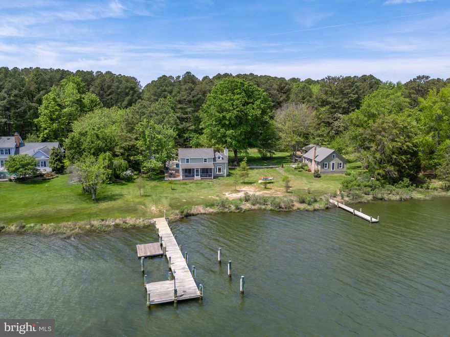 Absolutely gorgeous waterfront compound on  Cummings Creek in Talbot County just outside of historic Saint Michaels. Sited on a total of 5.2 +/- acres, with over 230’ of shoreline combined this offering includes three parcels complete with a main house, guest cottage, guest cottage / studio, detached garage-storage building ,saltwater swimming pool, numerous decks, two piers and floating dock. Everything has been meticulously renovated from top to bottom! The main house has a fabulous wrap around deck, waterside screened porch, open floor plan with beamed ceilings, wood flooring throughout, beautiful kitchen with high end appliances and a waterside great room with gas fireplace and breathtaking  views. The custom mud/utility room has a stacked washer and dryer, tons of  cabinetry, plus top of the line bathroom. The second floor has two adorable bedrooms with water views, a private dressing room and beautiful  custom bathroom. The charming two bedroom,  guest cottage features a large deck, beautiful shiplap walls, vaulted beamed ceiling, eat-in kitchen, full bath with washer & dryer family room with wood stove and cozy loft area.  A separate  private studio with a cozy deck, great room with vaulted ceiling,  kitchen and full bathroom. Amish built storage shed. With its idyllic setting and impeccable design, this Eastern Shore retreat promises a lifestyle of unparalleled tranquility and luxury. Map 22 - Parcels #339 (22741 Marshall Lane), #100 (22743 Marshall Lane), #160 (22747 Marshall Lane) all included totaling 5.206+/- acres. Renovated 2020-2023. Three separate deeds but being sold all at one time . Two wells . Encapsulated crawl space. Guest house is out of flood zone. MLS shows total number of bedrooms and baths from all three parcels. Room sizes for main house only - see floor plan for all room sizes.  Square footage is larger than tax records indicate.  Call for property brochure.