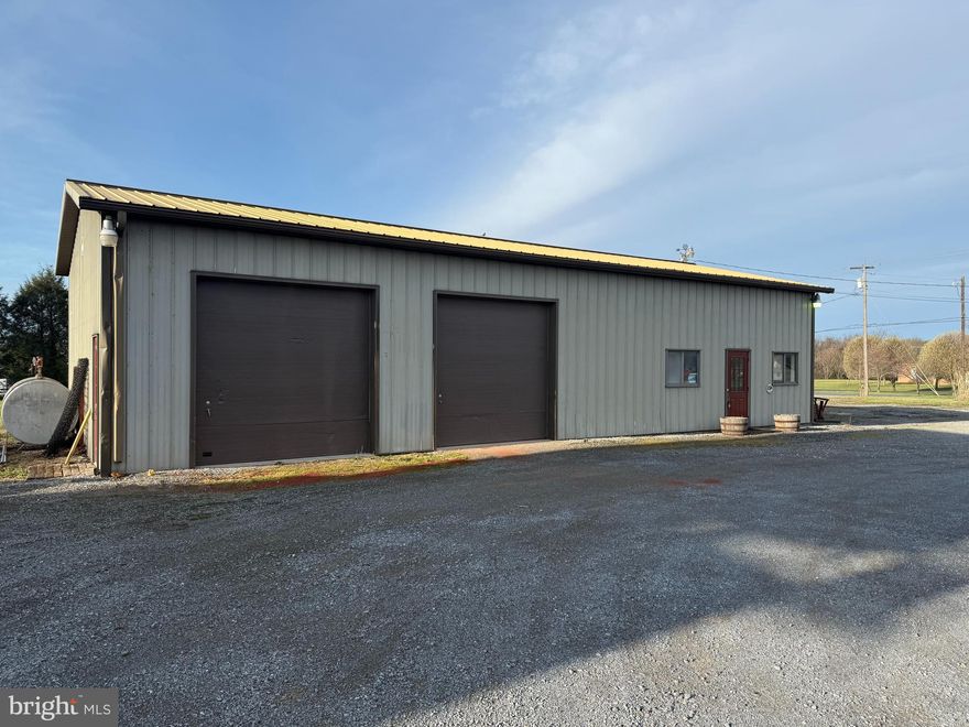 This commercial corner lot  has great potential. Bring your active business  OR start a new one here! Being located between Greencastle and Mercersburg offers great access and exposure to the public. The well maintained Morton Building is approx 30' x 60'  and is equipt with two 10' high garage doors, 1,600sf of working garage space,  200sf of office space and  200sf of utility/ restroom/storage space. Additionally this lot offers two road entrances making the lot accessable to large trucks with trailers from both Buchanan Trl and Heisey Rd.