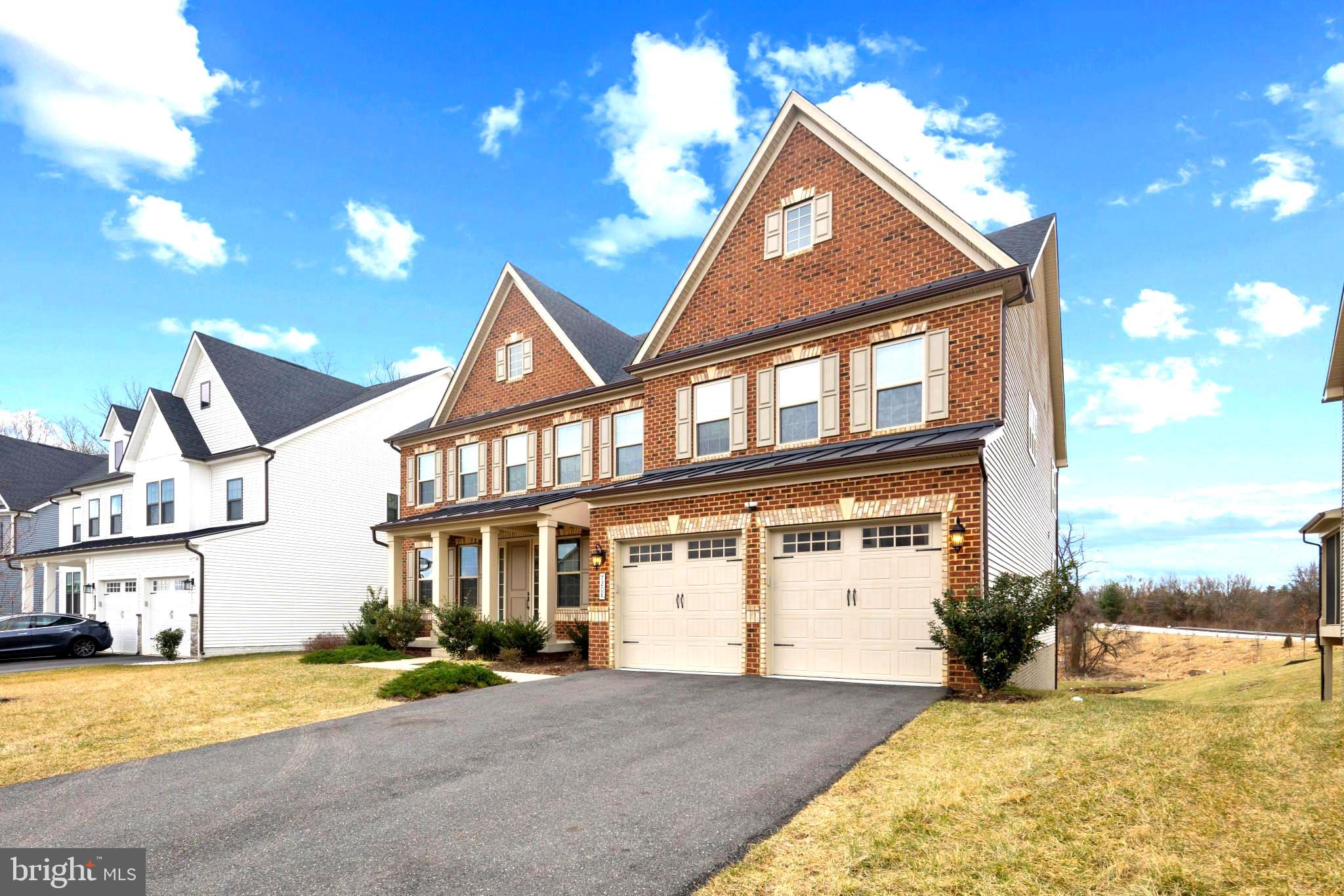 Welcome to a home that masterfully blends elegance, functionality, and opportunity.
It's symmetrical brick facade,gabled roof. and shuttered windows are hallmark features of Colononial Revival architecture.The porch with columns at the entrance adds to its charm. This 6,536 -sq.ft floor plan nestled in the prestigious Cedar Creek community, offers six bedrooms and six-and-a-half bathrooms, including a luxurious primary suite with dual walk-in closets and a spa-like en-suite bathroom. Each additional bedroom comes with its own en-suite and walk-in closet, ensuring ultimate privacy and comfort.
The gourmet kitchen, complete with stainless steel appliances, quartz countertops, and a spacious island, invites culinary creativity while offering ample storage space.
Step into the magnificent two-story great room, where floor-to-ceiling windows create an ever-changing canvas of light and scenery. By day, sunlight pours in, filling the space with warmth and energy. By night, the windows frame a peaceful view of the stars, offering a moment of quiet reflection. It’s a perfect blend of elegance and comfort, designed to connect you with the beauty of nature every single day.
The finished lower level adds exceptional versatility with its cozy, fully carpeted design. It features a private bedroom with a closet, ideal for guests or extended family, and a walk-out leading to a serene green space.
The location has convenient access to shopping, dining, and recreation, as well as major hubs like Washington, D.C., Baltimore, BWI Airport and Hanover. From practical features like the upper-floor laundry room to the potential for personalized outdoor living, this house isn’t just a property—it’s the place where your best memories are waiting to unfold!