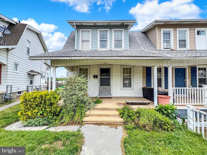Old world charm in this semi-detached home on low traffic street. A covered front porch welcomes you into the spacious Living Room w/crown moldings, wide baseboard moldings throughout & ceiling fan. Formal Dining Room through the French doors with wood parquet flooring & ceiling fan with access to the Kitchen. Side entrance from the outside is available to Kitchen as well. Off the back of the kitchen is the mudroom with another exterior side door. The upper level offers 3 nice sized Bedrooms with period lighting in two, updated flooring & ceiling fan in the other. The Full Bath at the end of the hall has a cast iron soaking tub, updated toilet, pedestal sink & vinyl flooring. The lower level is unfinished, which houses the mechanicals (updated gas furnace, updated gas hot water heater & 100 AMP Elec Service) + washer/dryer with available space for a work bench & plenty of storage (radial saw stays). The rear yard is level, has fencing on both sides & an oversized 2 Car Detached Garage w/alley access. The garage has electric, is wired for a compressor, cement floor & kerosene heater.  The workbench & cabinets stay!  A lot to like about this home. Some sweat equity can bring out the shine & give the opportunity to enjoy the dream of home ownership at an affordable price. Schedule your showing today
