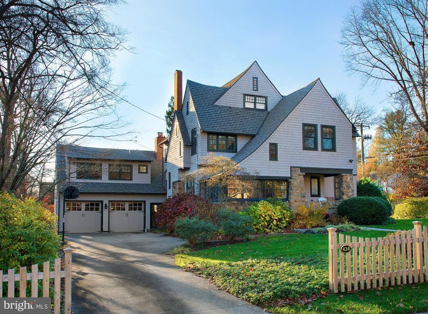 Experience the charm of this stunning 5 bedroom, 4.1 bathroom home on .77 landscaped acres in a prime walk-to-Wayne location! Make this gem yours and enjoy the comfort of its gracious rooms, the elegance of its classic details, and the allure of its many modern updates that include renovation of all bathrooms. The spacious Victorian-style colonial is warm and inviting with a welcoming center hall, lovely moldings, rich refinished hardwood floors, and wide openings to generously-sized main rooms.   Relax with family and guests around the wood-burning fireplace in the living room. Serve coffee or cocktails, or sit quietly and read a book in the light-bathed vaulted sunroom. Share meals and celebrate occasions gathered around the table in the spacious formal dining room. Cook up delicious meals in the bright and beautiful updated kitchen featuring abundant cabinetry, ample marble counters for prepping, stainless steel appliances by Sub-Zero and Dacor, a walk-in pantry and bar area, counter with seating, and open breakfast room. Adjoining is a fabulous family room with a wall of built-ins encasing a stone gas-burning fireplace, vaulted beamed ceilings, and reclaimed random-width wood floors. Glass-paneled French doors lead out to the wonderful deck that overlooks the expansive and peaceful level yard. A convenient powder room, and mudroom accessing the attached 2-car garage complete the home's main level.  Ascend a small staircase to a vaulted open loft area, perfect as a game/media room, playroom, sitting room, great as an au pair suite, or an office/home theater which it's currently utilized as. Nearby sits a full bathroom.  Reached via main staircase is the 2nd story offering 4 bedrooms, 2 full baths with connecting shower, and a washer-dryer. Floor 3 houses an amazing vaulted-ceiling bedroom and full bath with soaking tub and stall shower, now used as the primary suite. Storage is excellent, with a walk-in closet and additional large closet in the bathroom. The part-finished, fully-carpeted lower level has lots of recreation and storage space.  Plus with full surround sound, 3-zone HVAC with Nest thermostats, security system, Ring doorbell & exterior floodlights, and a prime address near the train, shopping & top-rated Radnor schools, this is the one!