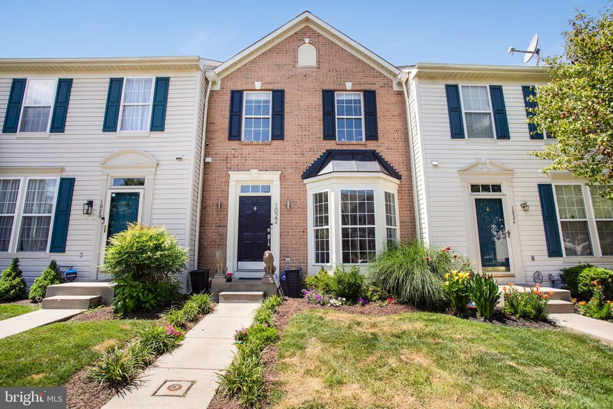 This is the one!  Meticulously maintained townhome in the highly desirable community of New Town.  The main level features an open floor plan with wood floors, a powder room off the entry way, a spacious living room area with bay window, and a kitchen/dining combo with bright white cabinets and a center island.  The inviting deck overlooks the beautifully fenced yard.  The upper level features an owners suite with ensuite bath and walk-in closet, 2 spacious bedrooms and a full bath.   The finished lower level has a huge recreation room (seller uses this space as a bedroom and office), a bonus room which can also be used as a bedroom/den/office (seller will leave furniture and tv if buyer wants it), and there's a full bath and laundry room as well.  Walkout to patio which backs to trees!  The seller is leaving the pergola as well as the outdoor seating.  There are recently installed blinds throughout the home and new light fixtures as well.  This homes has everything you need!  Lawn care and mulching included in HOA, 2 community pools, tennis courts, walking/jogging trails, playground, dog park.  Close to shopping and dining, BWI Airports