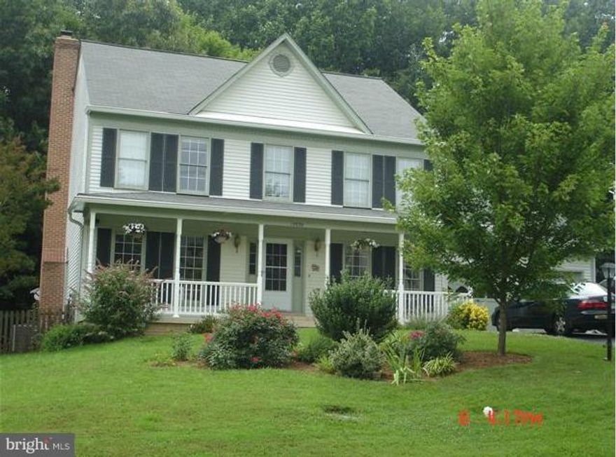 Ready to move in! Everything has been done for you. Fresh paint and new carpet throughout, bamboo wood floors on main level. Spacious rooms, wood burning fireplace, new smooth top range, large deck over looking wooded back yard. Huge basement. Luxury master bath. Covered front porch. Neighborhood close to shopping, dining and several commuting options within minutes. Call ahead for showing