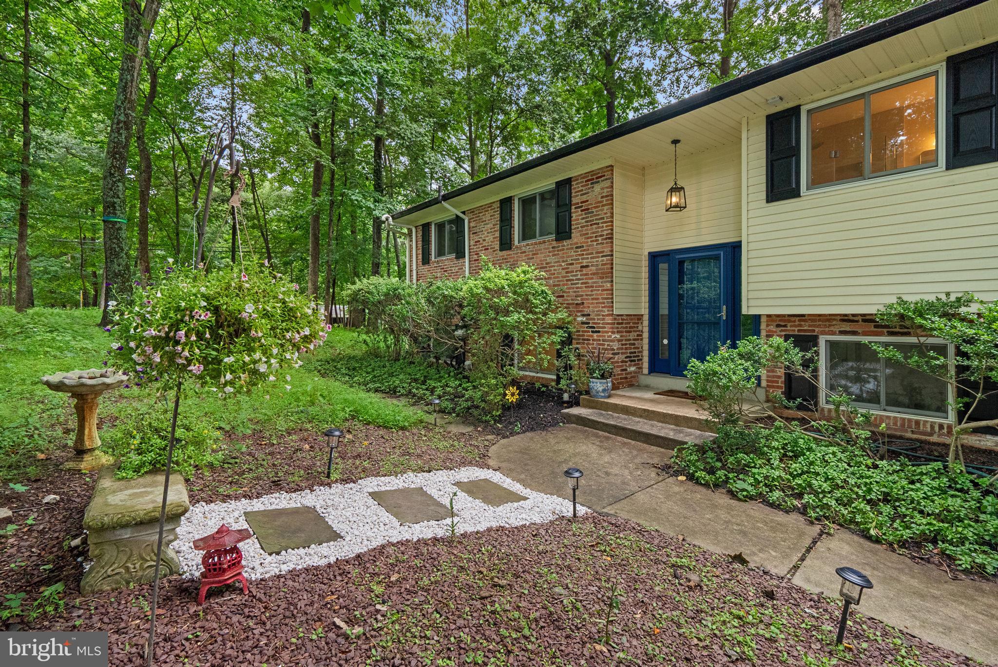 Come see this extraordinary 4-bedroom home with it's captivating updates and highly rated schools, before it disappears. This harmonius beauty is nestled on a scenic wooded corner section of a secluded neighborhood with an optional HOA that is focused on fun community social events. The spacious eat-in kitchen features a skylight, new flooring and granite countertops with a generous sink, newer stainless steel appliances, custom built cabinets, and a new microwave rangehood and dishwasher. The adjacent dining room offers built-in shelving, crown molding, and a solar tube for natural light. The family room also includes crown molding and opens to a large screened-in deck with skylights—perfect for relaxing or entertaining.
Three bedrooms on the main level include an owner's suite with a fully renovated private ensuite bath. Refinished genuine hardwood floors run throughout most of the main level. The finished lower level has new flooring and offers garage access, a double sink vanity and spacious shower, an additional bedroom, and a flexible space with a fireplace—ideal for a second family room, rec room, or home office—with walkout access to the patio. Additional highlights include a 2-car garage, mature landscaping, and access to a private neighborhood landscaped pond that is stocked for fishing, and a hill that is used for sledding by the neighborhood children. Enjoy community events like the summer picnic beside the pond.
This piece of paradise is conveniently located with easy access to major highways and big cities, yet this charming home offers relaxing comfort, character, and a true sense of community.