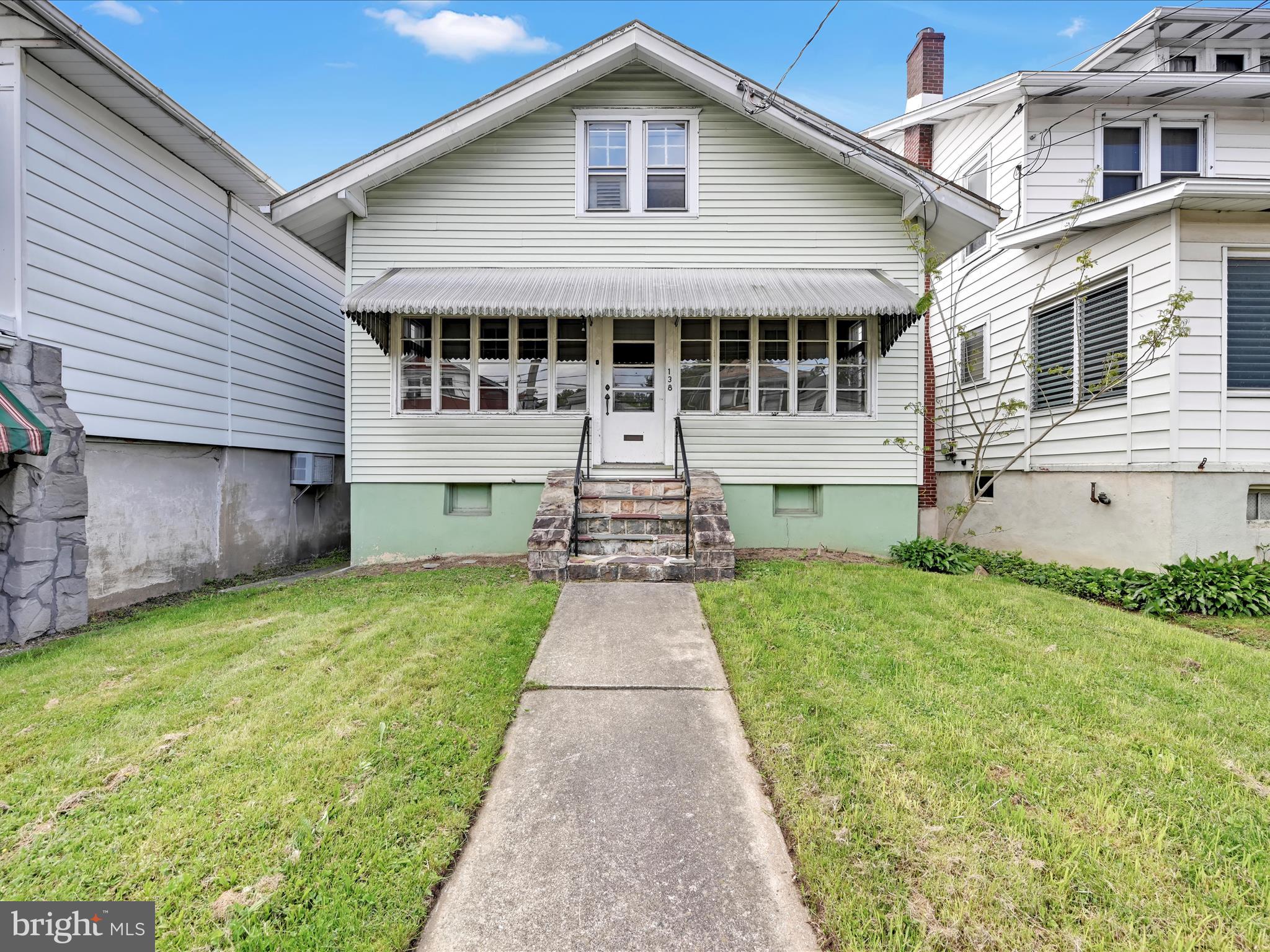 This 3-bedroom, 1-bath home offers easy, one-level living with everything conveniently located on the main floor-including laundry. Enjoy fresh new carpet, a recently recoated metal roof, and year-round comfort with central heat and air. Relax on either of the two enclosed porches, perfect for enjoying any season. Additional features include a built-in garage, off-street parking, and a low-maintenance yard. Move-in ready and ideal for those seeking comfort and convenience. Grocery store across the street, walking distance to bank, library, post office, restaurants, local shops.