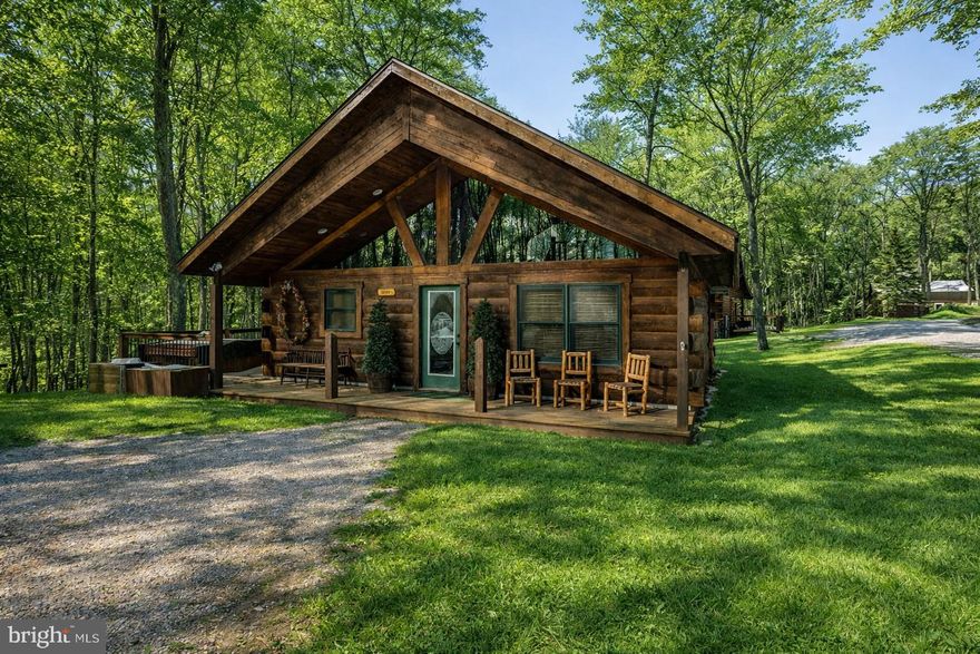 Here is the perfect little log cabin for you to call your resident, or vacation lake home or your investment rental.  Two Bedrooms with 1.5 Baths on one full acre.  No HOA, No Condo association.  Good privacy to enjoy your two porches and hot tub.  Plenty of parking for three vehicles.  Only minutes to Deep Creek Lake or head south to Oakland in ten minutes.  Surrounded by 10 State Parks and 5 Golf courses in Garrett Co.