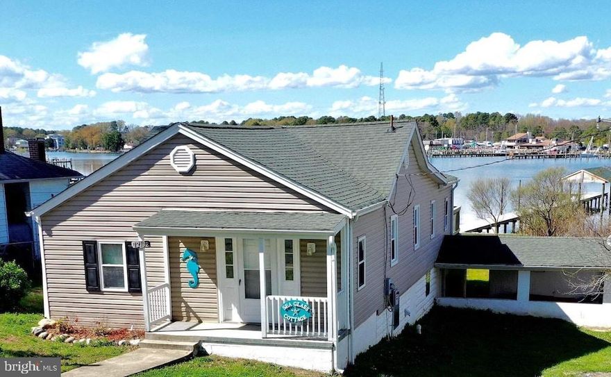 INVESTMENT POTENTIAL!!  Zoned for Mixed Use - Commercial /Residential - Step into the charming Seaglass Cottage, where modern updates seamlessly blend with classic coastal vibes. This waterfront cottage boasts an inviting open concept floorplan, creating a perfect harmony of space for both commercial and residential use. Imagine waking up to the tranquil views from the three bedrooms, complemented by two full bathrooms for added convenience. The heart of the home lies in the kitchen, dining area, and great room, leading to a sprawling deck that captures breathtaking panoramas of Neale Sound and the bridge.  Enjoy private access to a sandy beach and a 6' wide wharf with a covered boat house, epitomizing the ideal waterfront lifestyle. Also, an upgraded state of the art seawall that will protect your shoreline for years to come. The versatility of this property extends to its history as a successful VRBO, offering a lucrative opportunity for rental income. The interior features luxury vinyl plank (LVP) and ceramic tile flooring, with an unfinished basement providing ample space for utilities and storage. Nestled near the Cobb Island Market, this cottage is not just a residence; it's a year-round sanctuary, a summer retreat, or a weekend escape. Welcome to a place where coastal living meets endless possibilities. Also listed commercially - MLS#MDCH2028302