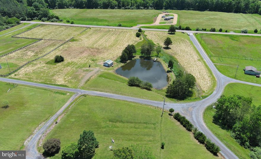 LITTLE FARM....BIG POND! 6.75 ACRES OF OPEN LAND LOCATED IN THE NORTH RIVER VALLEY WITH 4/10 OF AN ACRE STOCKED POND, MOUNTAIN VIEWS AND 20X20 METAL GARAGE. EASY ACCESS FRONTING ON PAVED ROAD, ONLY 35 MINUTES WEST OF WINCHESTER, VA AND AN EASY 2 HOUR DRIVE FROM DC. POWER & PERKED, EASY TO BUILD ON AND MINIMAL INFRASTRUCTURE COSTS TO GET YOU READY TO BUILD. PERFECT FOR MINI FARM.....CHICKENS, GOATS, A FEW HORSES....YOU GET THE IDEA. THE POND IS AWESOME AND IS ABSOLUTELY LOADED WITH FISH.....THE GARAGE IS NICE TOO, POURED FLOOR AND PLENTY ROOM FOR YOUR TRACTOR & TOYS. BUILD OVERLOOKING THE POND, LOOKING INTO NORTH RIVER MOUNTAIN AND LOOKING UP AND DOWN THE NORTH RIVER VALLEY! COMMUNITY ALLOWS DOUBLEWIDES ON PERMANENT FOUNDATION....MINIMAL & REASONABLE RESTRICTIONS. IF YOU WERE STARTING FROM SCRATCH, YOU'D EASILY HAVE 25K IN THE DRIVEWAY, POND & GARAGE THAT'S ALREADY IN PLACE. IT'S GETTING TOUGHER EVERY DAY TO FIND PROPERTIES LIKE THIS ONE, HERE'S YOUR CHANCE! IT'S TIME TO MAKE THE MOVE TO WV AND START LIVING THE SIMPLE LIFE....LOW TAXES, LOW CRIME, LOW RULES, LOW PRICES......HIGH ON BEAUTY & FREEDOM! DECLARE YOUR INDEPENDENCE FROM THE OPPRESSIVE STATE YOU CURRENTLY RESIDE AND LET FREEDOM RING!