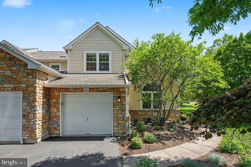 Welcome to 221 Canterbury Court, a beautifully updated end-unit townhome ideally situated on one of the most desirable lots within the Village of Canterbury at Blue Bell Country Club. Overlooking the breathtaking 18th fairway, this exceptional residence offers stunning golf course views, thoughtful upgrades throughout, and the low-maintenance luxury lifestyle that makes this community so sought after. From the moment you enter the dramatic two-story foyer, you’ll appreciate the abundance of natural light, gorgeous hardwood flooring throughout the main level, and the meticulous care this home has received.

The beautifully renovated gourmet kitchen is truly the heart of the home, featuring a stunning Calcutta Gold quartz island, updated soft-close cabinetry, Bosch stainless steel appliances, a wine refrigerator, and an exceptional workspace for both everyday living and entertaining. The adjacent family room with a gas fireplace opens to an updated TREX deck where you can relax and enjoy panoramic views of the golf course’s signature 18th fairway. The spacious living and dining areas offer elegant yet comfortable spaces for gatherings. At the same time, the updated first-floor powder room and well-designed laundry room with a stacked full-size washer and dryer, custom cabinetry, and direct garage access add everyday convenience.

Upstairs, the luxurious primary suite offers a true retreat with a spacious sitting area or home office, created from the original third-bedroom layout, a large walk-in closet, and a beautifully updated en-suite bath featuring a marble-enclosed shower, a double quartz vanity, and a jetted soaking tub. An additional guest bedroom with plush carpeting is serviced by a fully renovated hall bathroom showcasing a glass-enclosed shower with pebble flooring for a spa-like feel. The finished lower level expands the living space significantly, with plush carpeting, a spare bedroom, a professionally waterproofed basement, a cedar closet, new basement windows, and abundant unfinished storage space, complete with built-in shelving for seasonal décor and luggage.

Additional upgrades include Roof by Association in 2018, hurricane-rated replacement windows installed in 2020 with a transferable warranty, an HVAC system replaced in 2021, and numerous thoughtful improvements throughout. The HOA provides exceptional exterior maintenance and amenities, including roof replacement, siding, gutter cleaning and replacement, landscaping, snow and trash removal, a security gate, road maintenance, a clubhouse, a community center with dining and fitness rooms, pools, basketball courts, and more. Located within the award-winning Wissahickon School District and conveniently close to shopping, dining, major roadways, Center City, and the airport, this is a rare opportunity to enjoy carefree luxury living in one of Blue Bell’s premier communities.