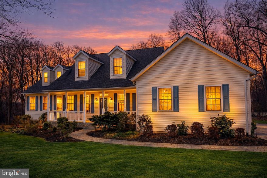 Set back behind a wooded tree line on 1.14 private acres in Hampstead, this custom-built Colonial is the kind of place families grow into and never want to leave. Nearly 5,000 finished square feet across three levels, with a total footprint pushing 5,638 square feet. Professionally cleaned and repainted top to bottom, the next family walks in on day one to something fresh and move-in ready. The yard is open, usable, and exactly what you have been looking for, with mature trees providing natural privacy on one side and a massive deck overlooking the backyard on the other. The kind of deck where summer happens, the grill runs all weekend, and evenings stretch longer than they should because nobody wants to go inside. A storage shed is already on site. Step inside to a custom office with glass French doors on your left and a formal dining room on your right. The great room is the true centerpiece, with vaulted ceilings, an open second floor, and one of three fireplaces anchoring the space. It flows naturally into a casual dining area and breakfast nook before connecting to the kitchen. The kitchen was built for people who actually cook. A Pro-Style Jenn-Air cooktop with four gas burners and a built-in indoor gas grill, a Frigidaire Gallery double convection wall oven, a stainless steel range hood, a center island, and a massive dedicated pantry. An owned and buried propane tank means no rental fees, no contracts, no hassle. The oversized two-car garage is fully repainted and finished with an electric door opener.
Downstairs, a finished rec room with a wet bar and third fireplace handles game nights, movie marathons, and playoff Sundays with ease. A flex room, dedicated wine cellar, and separate walkout sit behind it. A fifth bedroom and full bath make this one of the better in-law suite setups you will find at this price point.
Upstairs, three oversized bedrooms each feel like a genuine retreat, including one with its own en suite and a bonus unfinished room ready to finish into whatever your family needs. The primary suite has its own wing on the main level, complete with a step-in shower, soaking tub, and two walk-in closets. Five bedrooms, four full baths, a half bath, and three fireplaces. Infrastructure highlights include a new water heater (March 2026), dual heat pump systems (upper 2023, lower 2020), dual 225-amp electrical panels, an ecobee smart thermostat, a hardwired GE security system, and a full well water treatment and filtration system. Quick access to Routes 30 and 140, with I-795 connecting you to Baltimore and the beltway. Served by Hampstead Elementary, Shiloh Middle, and Manchester Valley High. The rural lifestyle without sacrificing the convenience. Schedule your showing today.