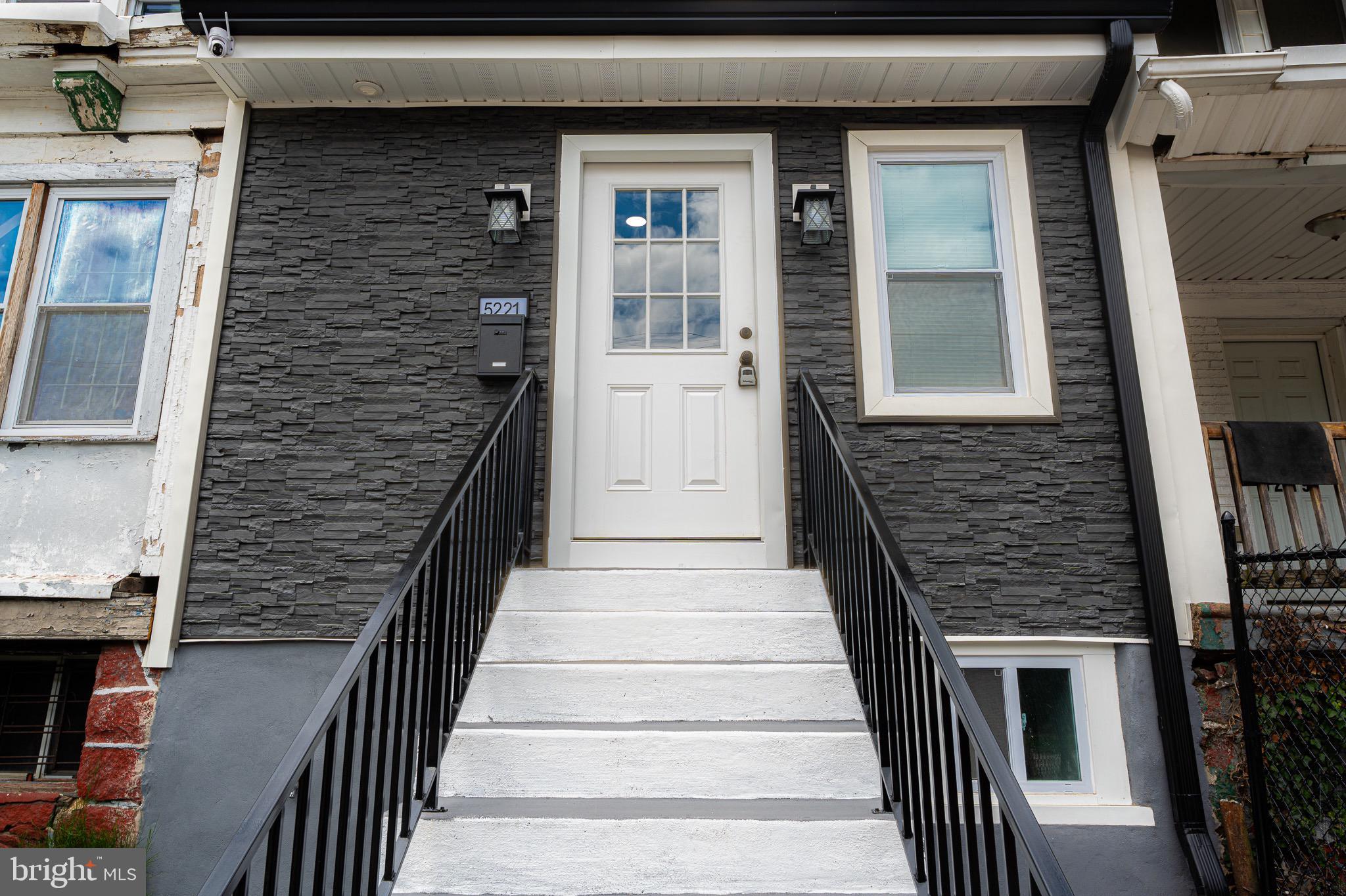Welcome to 5221 Warrington Abe, a stunning townhouse that offers the perfect blend of modern luxury and timeless charm. This spacious home features an inviting open floor plan with three generous bedrooms, two full baths, and a convenient powder room. Step inside to be greeted by gorgeous hardwood floors that flow seamlessly throughout the main level. The bright and airy living room and dining room are adorned with a media wall and powder room. The heart of the home is the gourmet kitchen, complete with a chic eat-at island, white shaker cabinetry, quartz countertops, stainless steel appliances, and a convenient pot filler for preparing large meals. Follow the custom black wrought iron railings to the second floor, where you'll find three well-appointed bedrooms. The hall bath includes a tub/shower combination and sleek porcelain tile. The second bedroom offers ample closet space, and a window that lets in just the right amount of daylight. The rear third bedroom is spacious enough for a queen-size bed and dressers, with sunlight streaming through the window to bring warmth and joy. The wrought iron railings in the hallway enhance the sense of openness and spaciousness. With laundry for convenience. Head downstairs to the lower level, which offers an open, finished basement perfect for entertaining, along full bathroom with stand up shower, an abundance of storage space, and 2nd media wall great for entertaining guests. Outside, you'll find a charming backyard ideal for gatherings with friends and family. Additional features include a new roof, all-new windows, central air.
This address also qualifies for Wells Fargo’s $10,000 Homebuyer Access Grant also a $5,000 closing cost credit program called Dream Plan Home and a complimenting mortgage program that only requires 3% down at a competitive interest rate and discounted PMI. these programs can be layered with most Down Payment Assistance programs in Philadelphia and across Pennsylvania, New Jersey and Delaware.