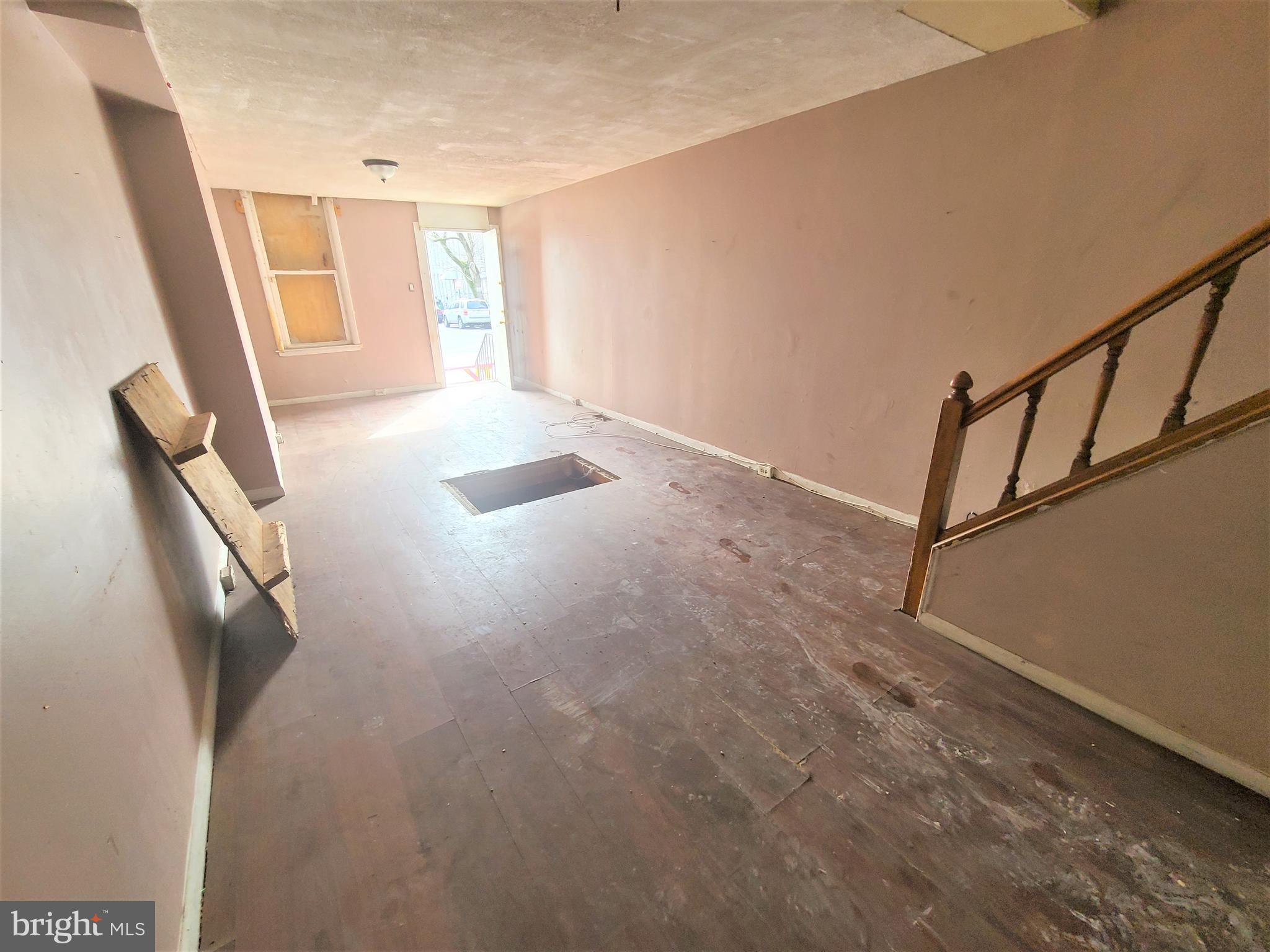 CALLING ALL INVESTORS! Spacious rowhome with large room sizes - perfect opportunity to fix up and add to your rental portfolio. Main level with an open floor plan, spacious living room with a dining area, and a kitchen, upper level with 2 bedrooms and 1 full bath. Sold As-Is! Seller will make no repairs.