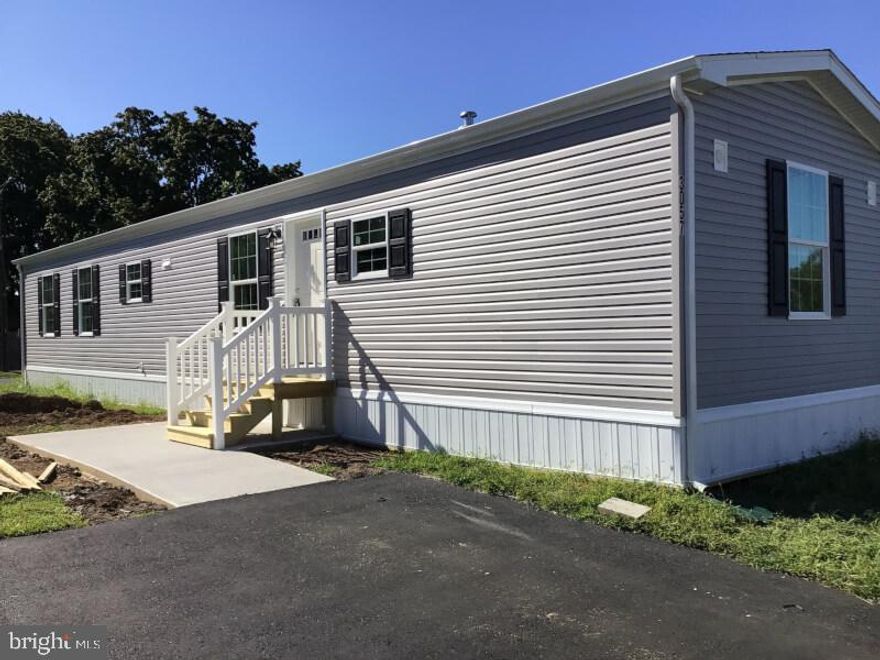 This affordable home comes complete. Two bedrooms and two full baths. One bath features a walk-in shower, and the other bath has a tub. Central air and upgraded kitchen appliances are also included. There is also a separate laundry room with laundry hook-ups. There is also an 8 x 8 custom built shed that matches the home. Built to last with great factory warranties and all LED lighting. Come see this home today.