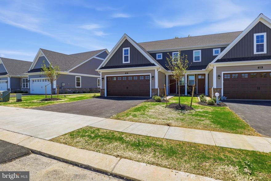 Welcome to Bellaride, the newest section of the sought-after Crossgates community in Millersville. This thoughtfully designed semi-detached home offers the perfect blend of comfort, convenience, and low-maintenance living—an ideal choice for downsizers, empty nesters, or anyone seeking a simpler lifestyle without compromising on style.

This home is complete and ready for occupancy. With over 1,900 square feet, this home features an open floor plan that makes everyday living and entertaining effortless. The kitchen, complete with a spacious island, flows seamlessly into the dining area and great room, creating a bright and inviting space. The primary suite is conveniently located on the main floor and includes a well-appointed private bath, offering the ease of first-floor living. A first-floor laundry room adds extra convenience.

Upstairs, you’ll find two additional bedrooms, a full bathroom, and a versatile loft that can serve as a cozy retreat, home office, or easily convert into a fourth bedroom if desired. With a two-car garage, 2 ½ baths, and a slab foundation, this home is designed for easy living with less upkeep.

Step outside your door and enjoy everything the Crossgates lifestyle has to offer—picturesque walking paths, a community ballfield, tennis courts, a public golf course, and even a restaurant right within the neighborhood. Millersville University and local shops are just a short walk away, while downtown Lancaster is only minutes from your doorstep. Best of all, the HOA takes care of snow removal and lawn mowing, giving you more time to relax and enjoy your home and community