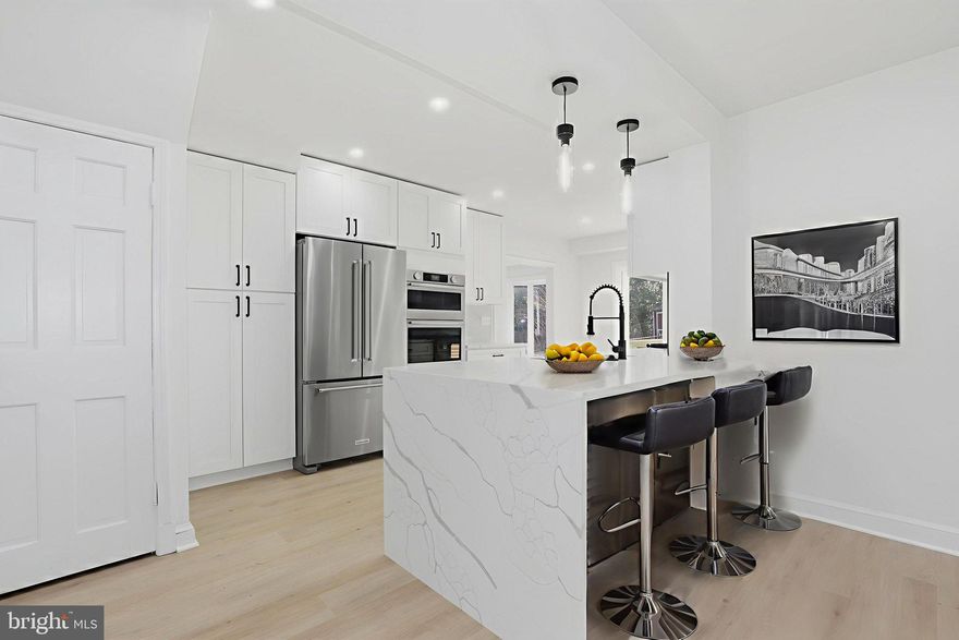 Top-to-bottom renovated three-level single-family home nestled in the highly desirable Seven Oaks neighborhood off Dale Drive—just steps to Sligo Creek Park and within walking distance to downtown Silver Spring’s shops, dining, and entertainment.

The main level features a spacious family room with a cozy fireplace, seamlessly open to the brand-new gourmet kitchen showcasing stainless steel appliances including wall oven-microwave combo, stove, range hood, refrigerator, dish washer and wine cooler , quartz countertops, upscale cabinetry, and a stunning waterfall quartz island. French glass doors lead to the new deck—perfect for indoor-outdoor living and entertaining. A formal dining room flows into the bright living room, creating an ideal layout for gatherings.

Upstairs, the primary suite offers a private, fully renovated bath with new tile, shower, vanity, toilet, fixtures, lighting, and mirror. Two additional generously sized bedrooms share a beautifully updated hallway bath featuring new tile, bathtub, vanity, toilet, fixtures, lighting, and mirror.

The fully finished lower level includes a fourth bedroom and a third full bath—completely renovated with new tile, bathtub, vanity, toilet, fixtures, lighting, and mirror. A large recreation room with windows and an exterior door provides abundant natural light and direct access to the backyard.

Major Updates Include: New flooring throughout; Fresh interior paint;  New lighting fixtures;  New roof; New hot water heater; New condenser, HVAC approximately 5 years old; Some brand-new windows and other windows approximately 9 years old; New deck; New concrete driveway with 3 parking spaces.

Located in a vibrant, walkable, and family-friendly neighborhood, this home offers easy access to nearby parks, shops, and dining. Just a short stroll to downtown Silver Spring, where you’ll find a wide variety of restaurants, entertainment, and retail options, including Whole Foods Market within walking distance. In the spring, take in the stunning cherry blossoms from the magnificent tree in the backyard—a truly special feature that enhances the charm of this wonderful community.