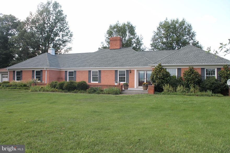 Gorgeous ranch home on over 14 acres boasting 4 bedrooms, 2.5 baths, dining room, huge living room, oversized family room, laundry area & mud room.Beautiful front porch overlooking mountain & rolling hill views.Full basement w/a huge rec room finished.Concrete patio on rear of home with scenic views. 2 car attached garage and 3 bay detached workshop.Lots of landscaping w/ multiple fruit trees.