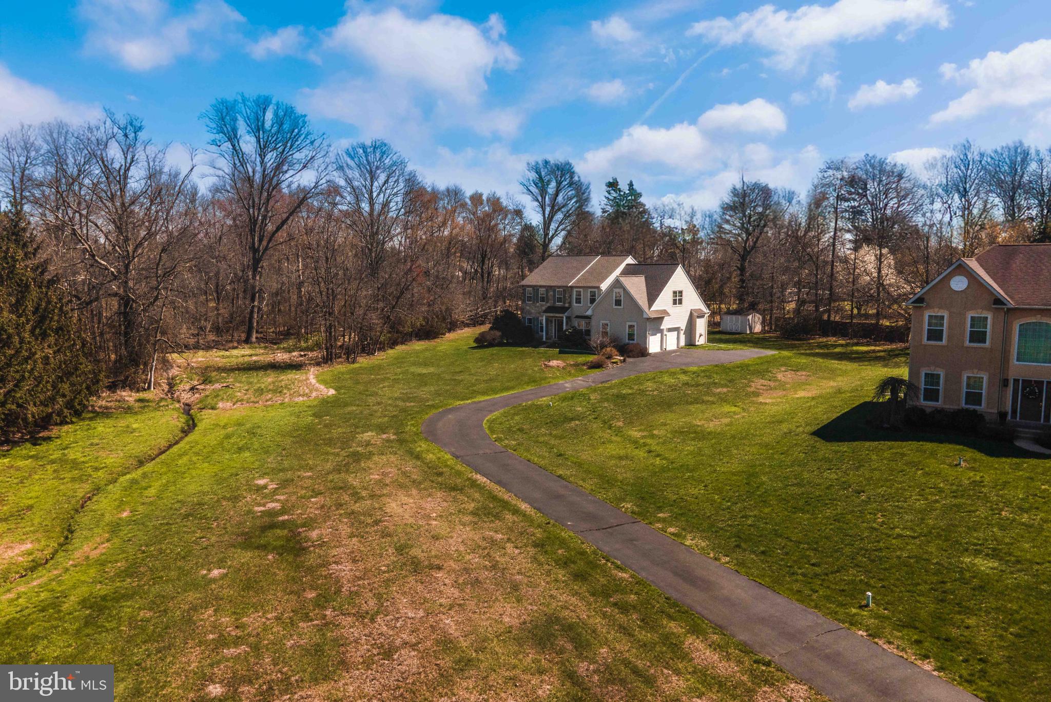 No HOA! Looking for a 4BDR, 2.5BA with a Finished Basement with land, wonderful amenities and privacy, your search is complete. 609 Ida Lane is nicely situated on 1.48 Acres on a Cul-De-Sac of 7 Homes in Hatfield Township in North Penn SD. Gas Heat, Cooking & Hot Water. A new Gas Hot Water Heater in 2023. Public Water & Sewer. Newer Double Hung Windows Replaced Mostly Throughout in 2010 along with the Front Door and Side Lights. Newer Roof, Gas Furnace and A/C in 2019. In 2022, new Hardwood Floors were installed in the Foyer, Living & Dining Room and Study. Fully and Beautifully Renovated Kitchen Cabinets, Countertops, Stove and Kitchen Flooring in 2020. A long and winding driveway greets you as you approach 609 Ida with a two car side entry garage with insulated doors and covered front porch. The entry reveals a Two Story Foyer that opens to a Double Door Entry Study. The Study has a beautiful bay window seat(just add pillows to relax with your favorite book) which has been freshly painted. The foyer area includes a Coat Closet and a Powder Room. The living and formal dining flow together which is wonderful for those special occasion and holiday gatherings. The dining room is accented with crown molding & chair rail with freshly painted neutral walls that overlooks a tree lined backyard. A must see kitchen that was beautifully and completely renovated in 2020, it's a Wow. The kitchen is equipped with new 42" Soft Close Cabinets with slide out drawers, Stainless Steel Appliances with a Cooking Vent, Quartz countertops, Island with electric and pendant lighting, double sink, recessed lighting, gorgeous backsplash and tile flooring along with a pantry. The kitchen breakfast room is bumped out with a Slider Door that leads to the expansive deck, shed and tree lined backyard. Off the kitchen, there is a laundry room with access to the garage. Inviting family room has a vaulted ceiling, gas fireplace, ceiling fan and a great place to relax watching your favorite team or relaxing reading a book. The primary bedroom with a sitting room, ceiling fan and two walk in closets that connect to the primary bath. The primary bath has a private toilet room, double vanity, tile flooring, shower and tub. There are three additional bedrooms that share a hallway full bath. To complete this fabulous home, there is a finished basement which currently is used as an additional office and game room(pool table included), crawl space and utility room. Beautiful home, fabulous convenient location, wonderful amenities, this home has it all! One year home warranty included. Information is reliable but not guaranteed and should be independently verified (measurements may not be exact).