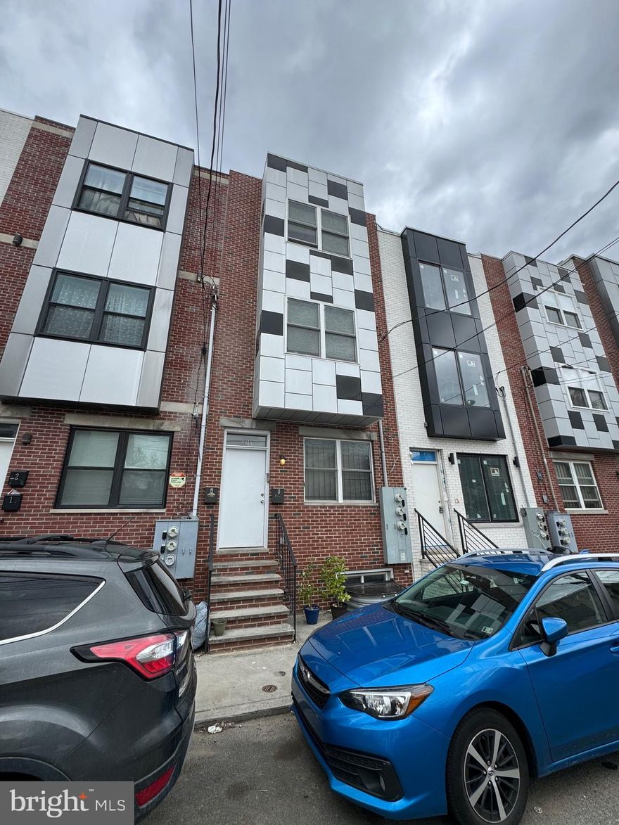 close to Temple University. Set up as a duplex with each bi-level unit containing 4 bedrooms, 4 full baths. Enter unit A into the GROUND level with living room, kitchen, 2 beds & 2baths and access to the large rear yard . Stairs to the LOWER level which boasts 2 more bright day light bedrooms with ample closet space  and  washer/dryer, 2 FULL baths. Enter unit B and ascend to the 2nd level which has an extra-large kitchen, living room and dining room . There are an additional 2 beds and 2 full baths on this level. Stairs to the 3rd floor take you to another 2 beds and 2 baths with a hall stackable laundry closet.  built in 2016  with remaining tax abatement, central air and absolutely turnkey, ready to start generating income immediately. Numerous scenarios and possibilities that make this an excellent blue-chip investment. 8 total bedrooms with private bath full bath in property .  schedule your showing today!