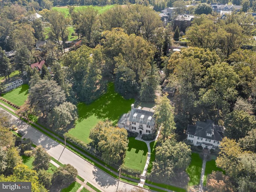 Welcome to 2209 Ken Oak Road, a striking Mount Washington gem offering a rare blend of beauty, architectural character, and investment potential in an idyllic location. Situated on over an acre of flat, usable land on one of the neighborhood’s most desirable tree-lined streets, this lovely property offers a welcoming stone walk, light post and mature flowering trees in the front yard that set the stage for the elegance and rich architectural details inside. 
This property is truly a standout in Mt. Washington for its zoning flexibility to be subdivided, exceptional private, detached garage sided by dual entries in the rear, and an extended driveway.  Recent upgrades and improvements totaling over $70,000.00 include upgraded plumbing and heating systems, high-efficiency radiators, a modern German gas boiler and transferable warranties. The home’s new Mitsubishi multi-zone ductless heat pump (installed 2025) provides energy-efficient heating and cooling for the upper levels, complementing the gas boiler, also new in 2025 for year-round comfort and cost savings.
Inside, memorable architectural elements include double entry doors, a charming vestibule with marble floors and decorative leaded glass sidelights, hardwood floors and stairs with scrolled wood newel posts, marble fireplace surrounds, and a vintage kitchen with metal cabinets and stainless-steel counter tops.
Interior updates feature fresh, neutral whole-house painting, modern lighting, and upgraded laundry plumbing, creating a move-in-ready environment with flexibility for the next owner to personalize kitchen, baths or porch spaces.
An independent zoning feasibility study by Morris & Ritchie Associates confirms the property’s potential for subdivision or a buildable lot, offering rare long-term benefit in this sought-after location. The extended rear driveway and detached, two-car garage provide exceptional convenience, added parking and privacy.
With multiple transferable warranties and service policies, no claims filed, and thoughtful mechanical and structural improvements, 2209 Ken Oak Road is a fantastic opportunity for those seeking timeless Mt. Washington charm, neutral interiors and future potential, all in one incredible property in Mount Washington.